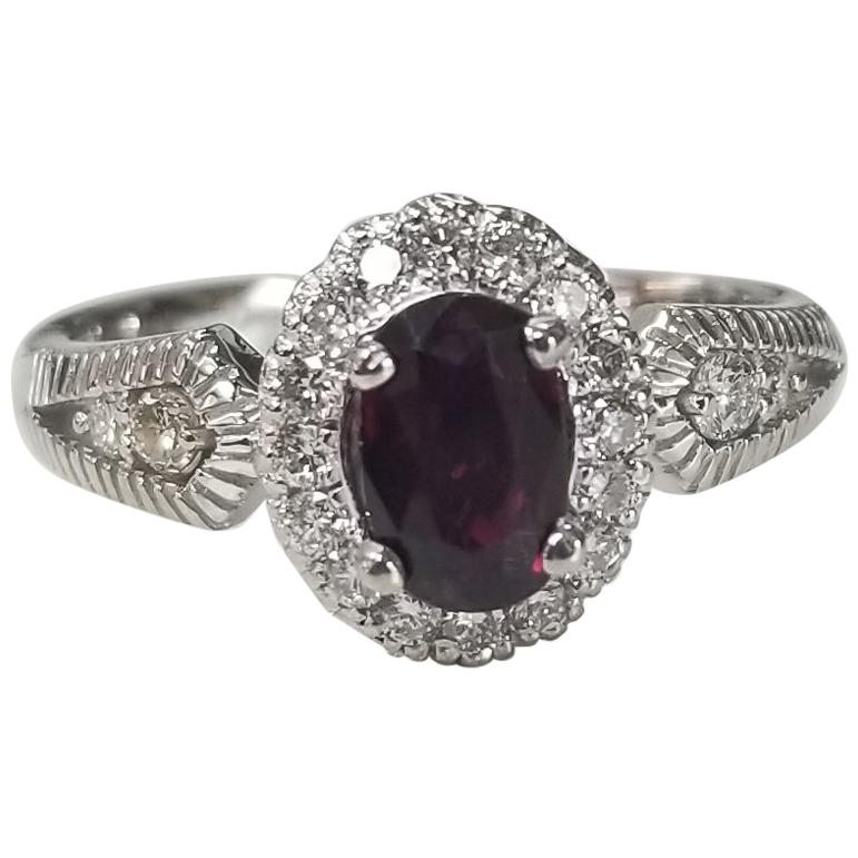 14 Karat White Gold Oval Ruby and Diamond Halo Ring