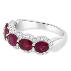 14 Karat White Gold Oval Ruby and Round Diamond Halo Ring