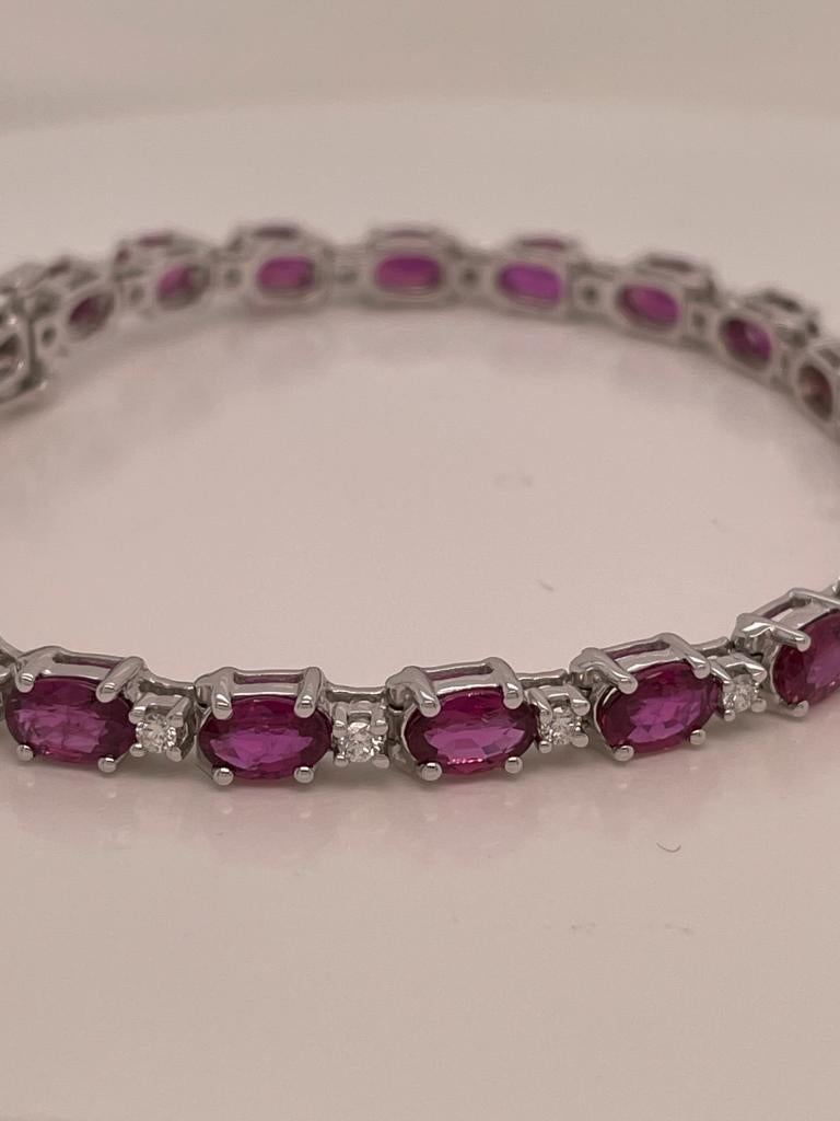 21 pieces of oval rubies weighing 10.84 cts
Measuring (6.0x4.0) mm
21 pieces of diamonds weighing .52 cts
Set in 14K white gold bracelet
