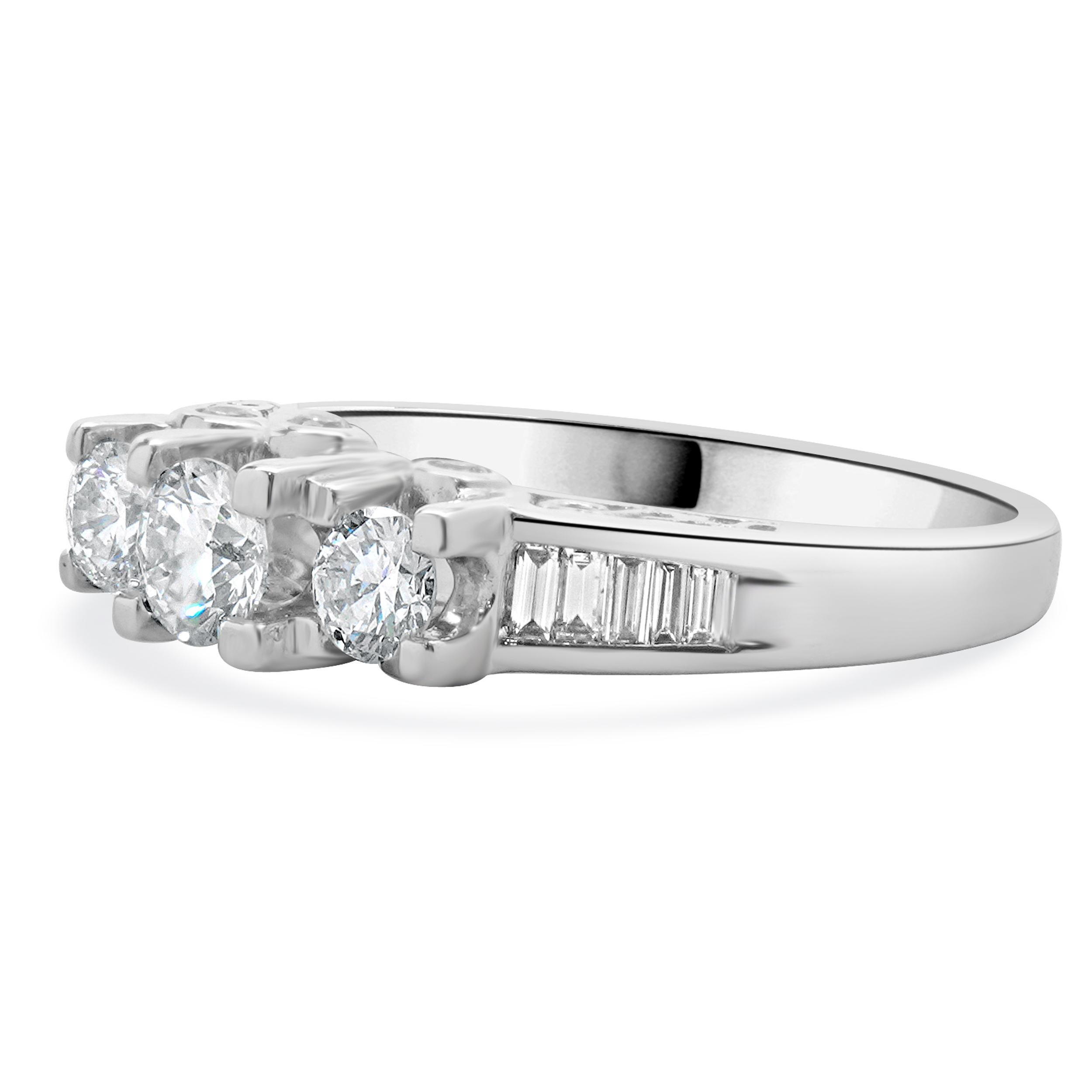 Material: 14K white gold
Diamond: 19 round and baguette cut = 0.95cttw
Color: G/H
Clarity: SI2
Ring Size: 7.25 (please allow up to 2 additional business days for sizing requests)
Dimensions: ring top measures 6mm wide
Weight: 4.49 grams