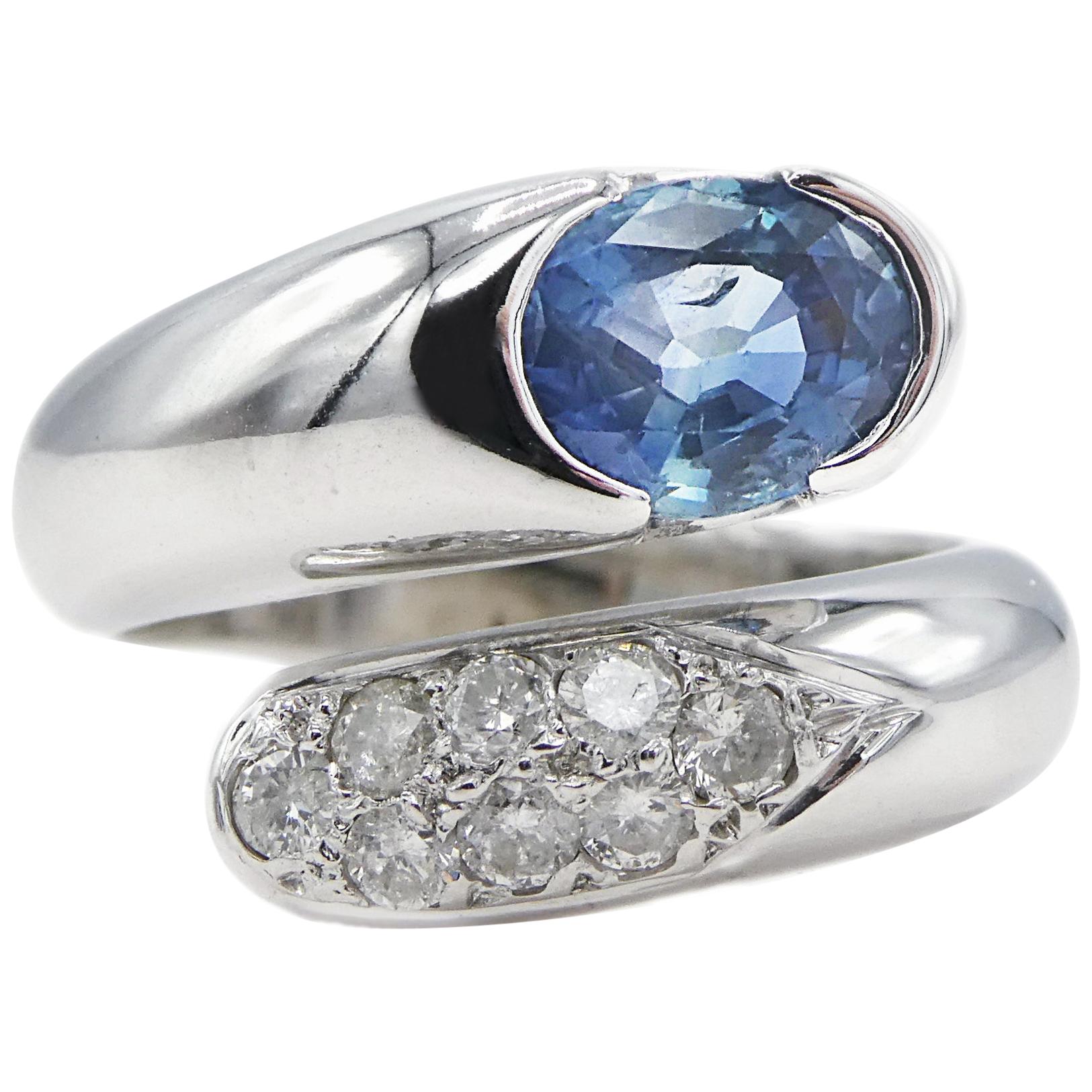14 Karat White Gold Pave Diamond and Oval Blue Sapphire Bypass Cocktail Ring
