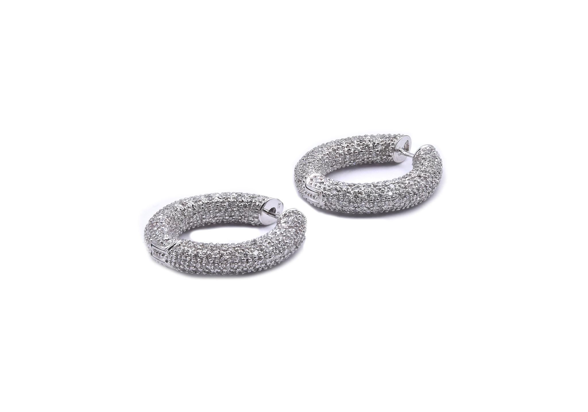 Designer: custom
Material: 14K white gold
Diamonds: round cut = 3.00cttw
Color: G
Clarity: SI2
Dimensions: earrings measure 30mm long
Weight: 18.50 grams
