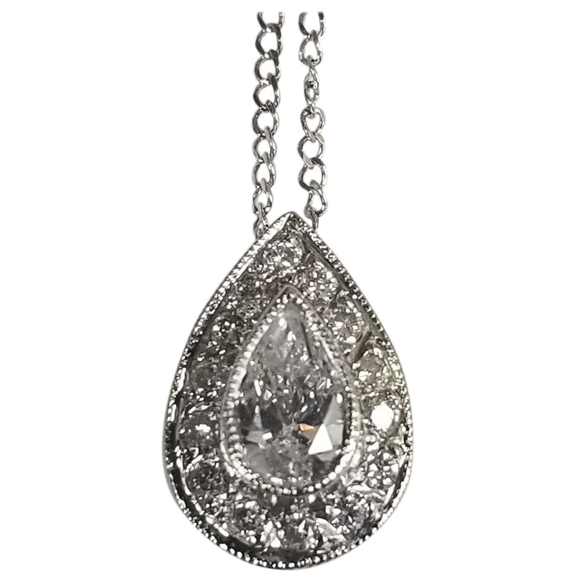 14 Karat White Gold Pear Shape Diamond Pendant with Halo Setting For Sale