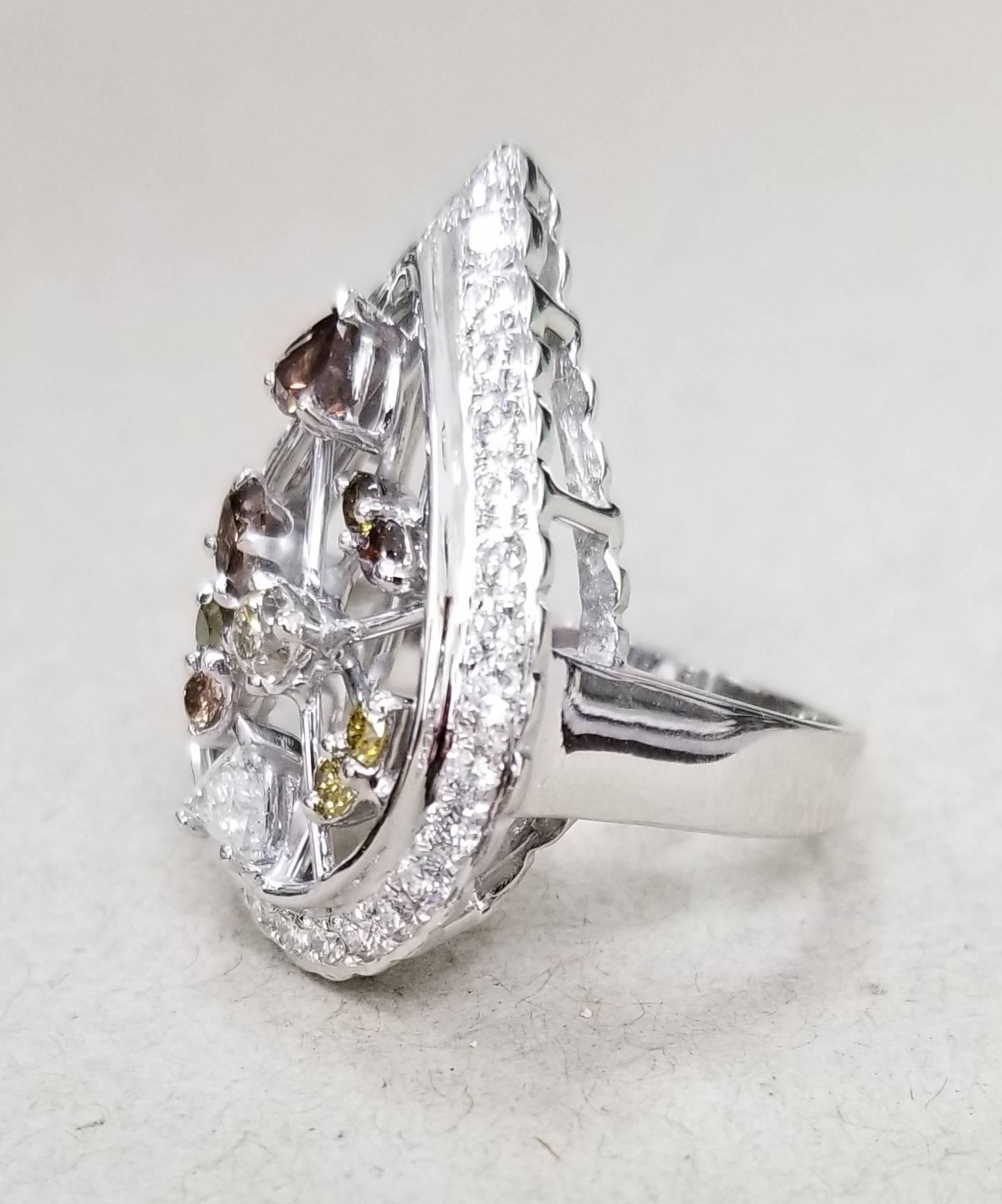 14k white gold pear shape setting with 30 round full cut diamonds of very fine quality weighing .90pts. set with 10 natural diamonds; white, yellow and brown weighing 1.15cts. ring size is 7 