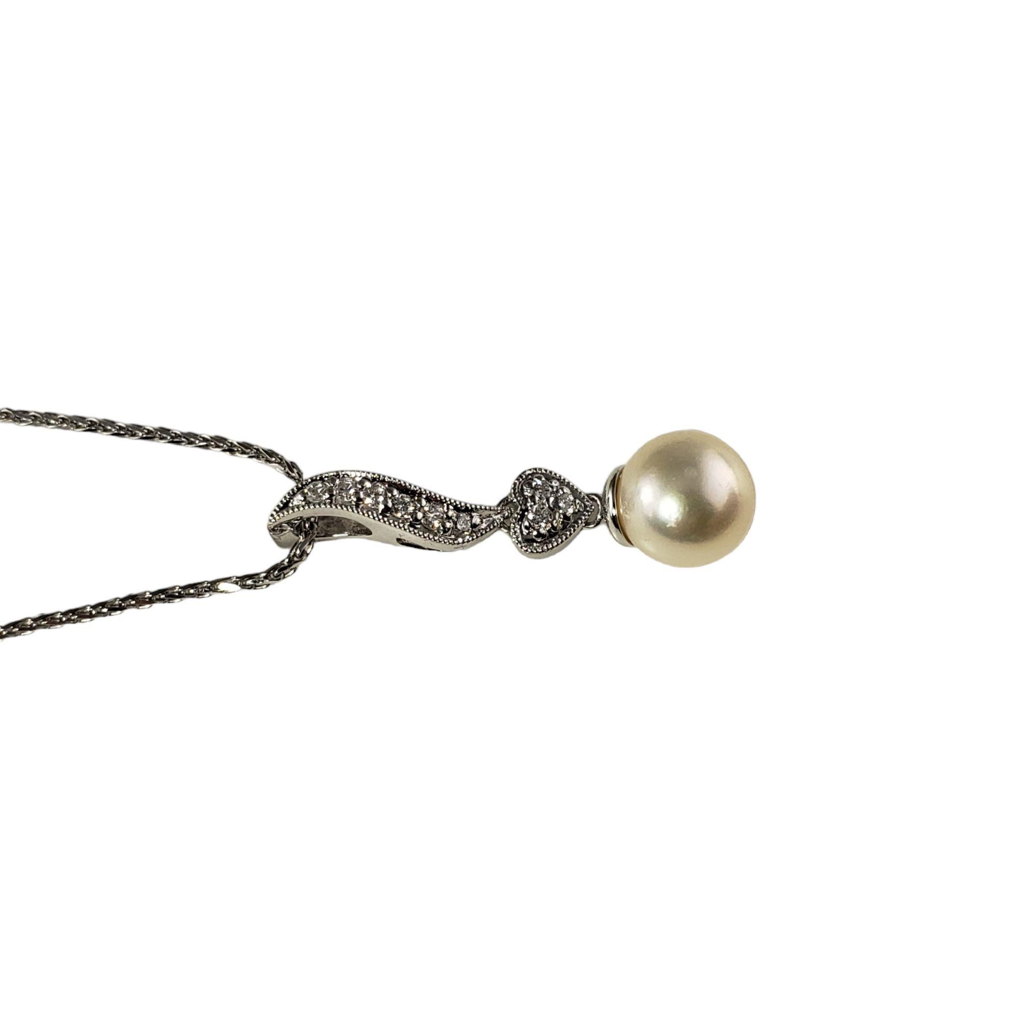 Vintage 14 Karat White Gold Pearl and Diamond Pendant Necklace-

This lovely pendant necklace features one 8 mm pearl and nine round brilliant cut diamonds set in 14K white gold.

*Matching earrings: RL-00013920

Approximate total diamond weight: