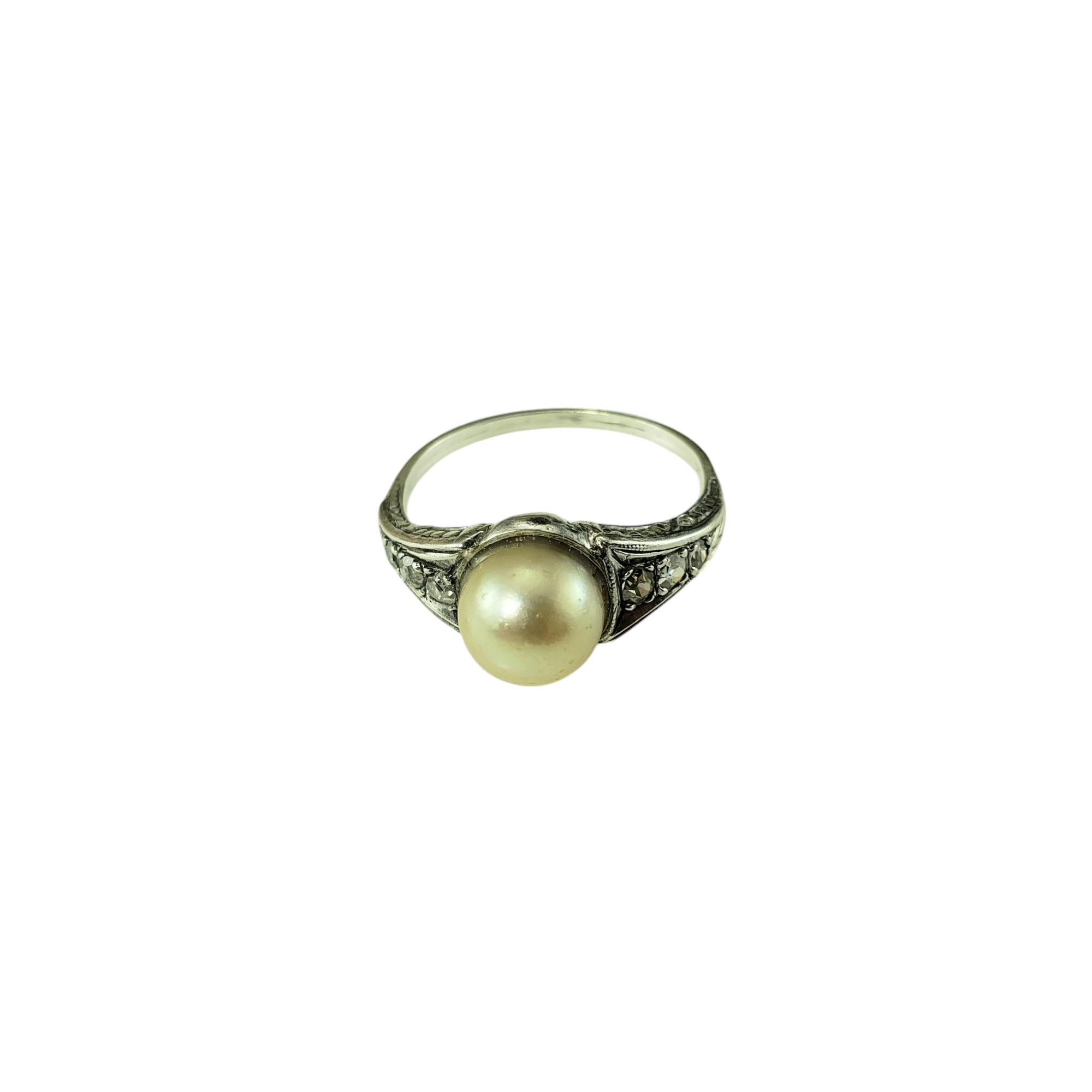 14 Karat White Gold Pearl and Diamond Ring

This elegant ring features one round white pearl (8 mm) and six round old mine cut diamonds* set in 14K white gold.

Shank: 1 mm.

Approximate total diamond weight: .05

Diamond color: I-K

Diamond