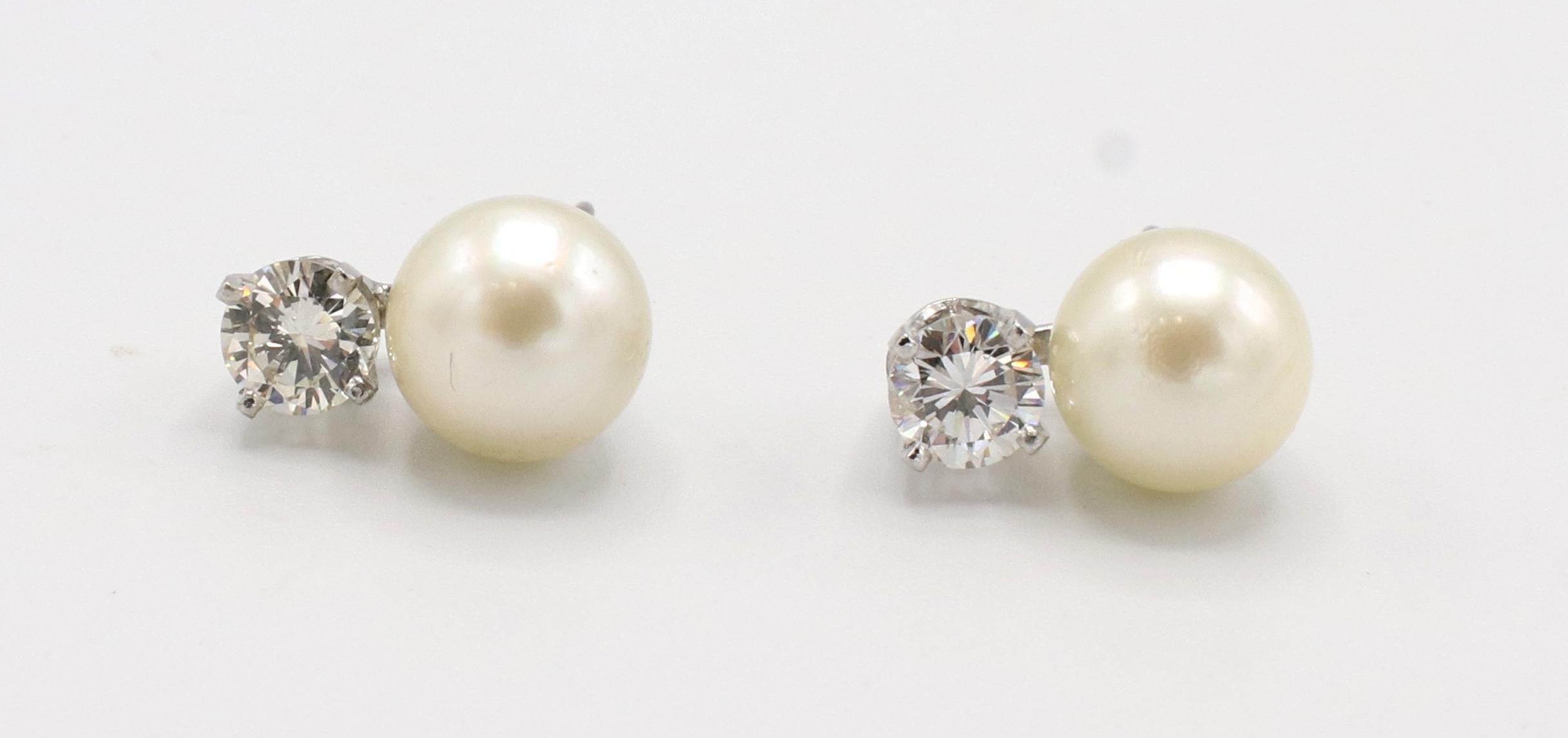 14 Karat White Gold Pearl & Natural Diamond Stud Earrings 
Metal: 14k white gold
Weight: 3.33 grams
Pearls: 7.7mm, white with a creamy luster
Diamonds: Approx. .68 CTW G-H VS-SI1 round natural diamonds
Length: 12mm

