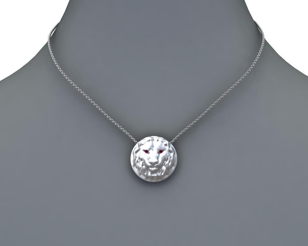 14k White Gold Lion Pendant Necklace 
with Ruby Eyes,  Matte finish, 21 mm diameter x 5.4 high on a 18 inch chain 1.5 mm wide.1.5 mm ruby eyes . 
This chain is for women , too too short and fine for men.
 I would recommend a 1.9 mm cable and 22-24