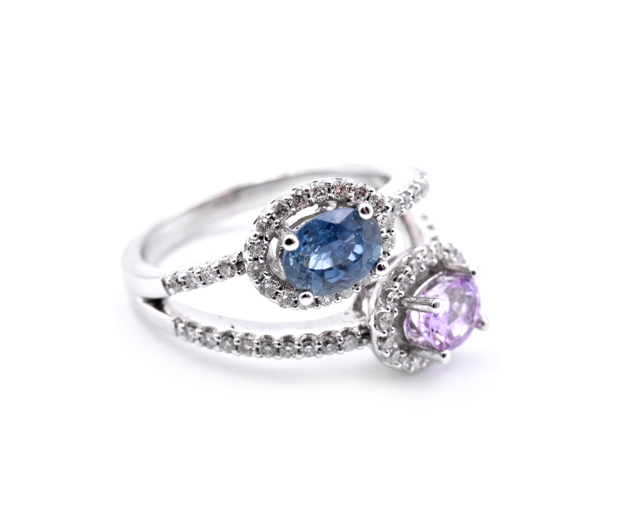 Designer: custom design
Material: 14 karat white gold
Gemstones: (2) sapphires = 1.80cttw Blue/Pink
Diamonds: .47cttw
Color: F
Clarity:  VS2-SI
Ring Size: 7.5 (please allow two additional shipping days for sizing requests)
Dimensions: ring top