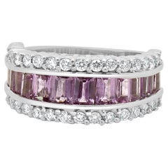 Anello a tre file di zaffiri rosa e diamanti in oro bianco 14 carati