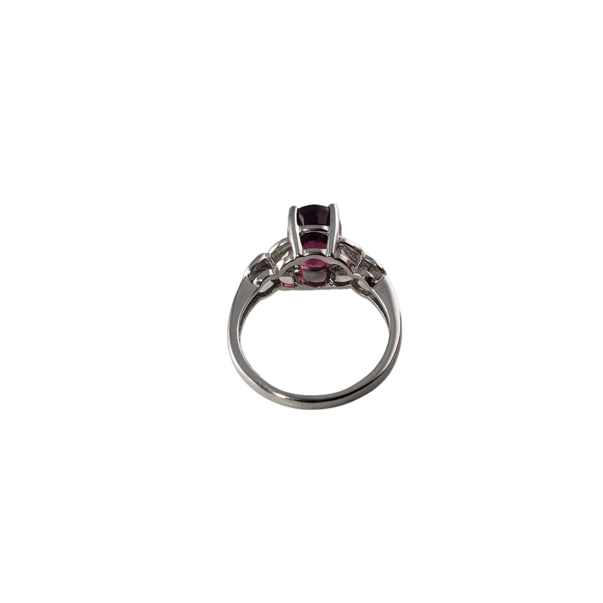 Vintage 14 Karat White Gold Pink Tourmaline and Diamond Ring Size 6.5-6.75 JAGi Certified-

This lovely ring features one oval pink tourmaline (9 mm x 7 mm) and ten round brilliant cut diamonds set in classic 14K white gold.
Shank: 2 mm.

Tourmaline