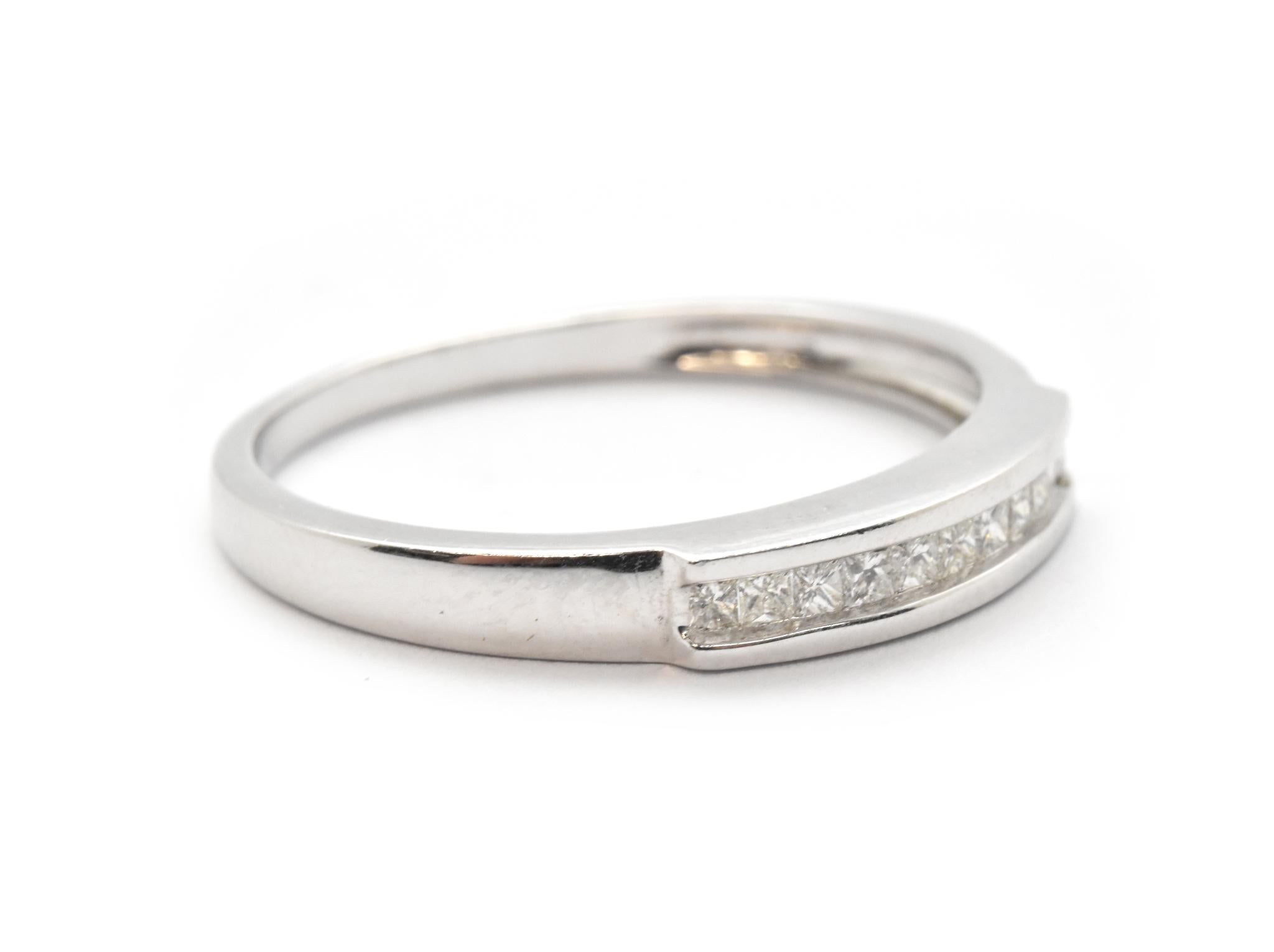 This princess cut diamond wedding band is the perfect way to show your lover their true importance! Diamonds are channel set and reach 0.33cttw. There is a beveled edge in the ring that separates where the diamonds are set from the band. Band size