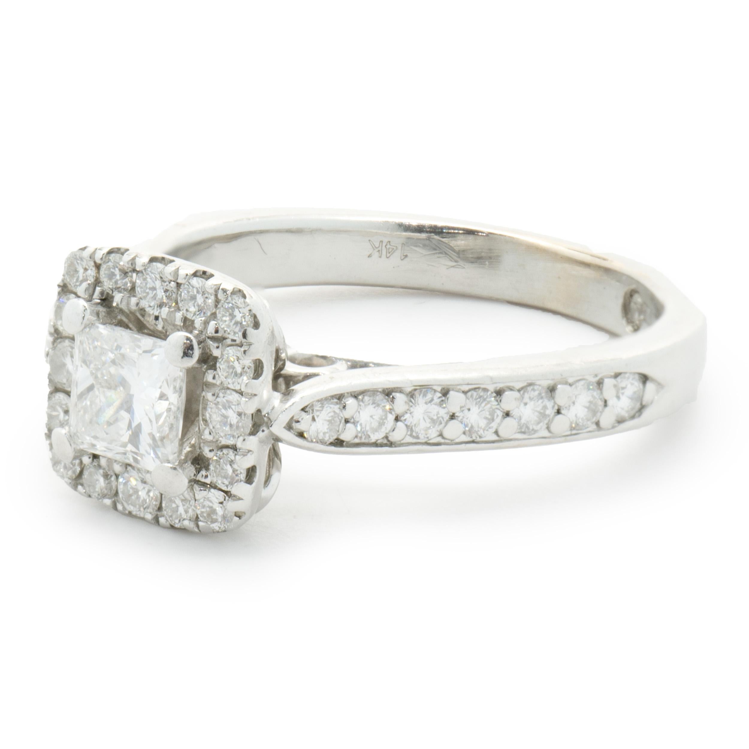 Designer: Custom
Material: 14K white gold
Diamond: 1 princess cut= 0.40ct
Color: I
Clarity: SI1
Diamond: 30 round brilliant cut= 0.45cttw
Color: H
Clarity: SI1
Dimensions: ring top measures 8mm wide
Ring Size: 4.75 (complimentary sizing