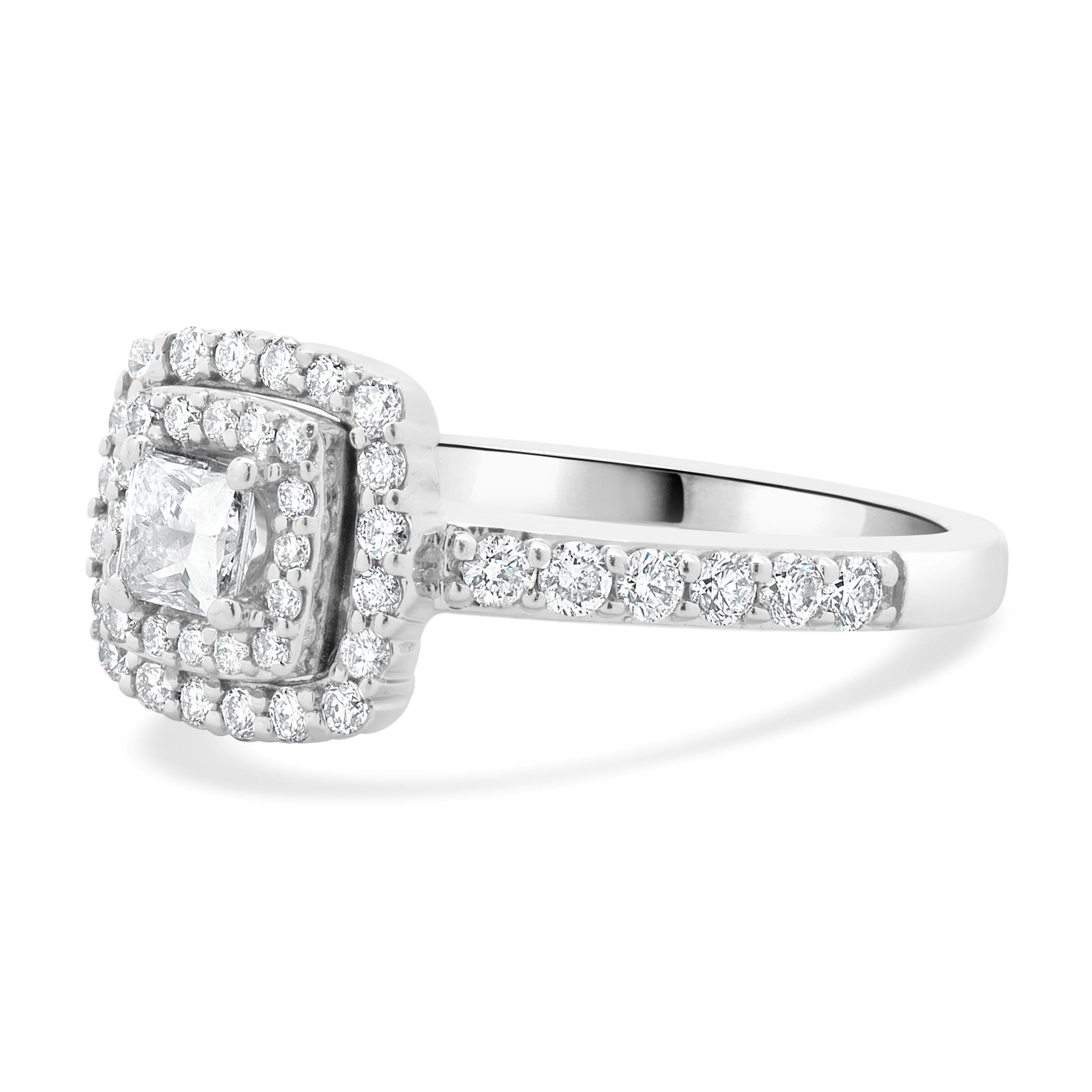 Designer: Custom
Material: 14K white gold
Diamond: 1 princess cut = 0.25ct
Color: I
Clarity: I1
Diamond: 48 round brilliant cut = 0.36cttw
Color: G  / H 
Clarity: SI1
Dimensions: ring top measures 9mm wide
Ring Size: 5 (complimentary sizing