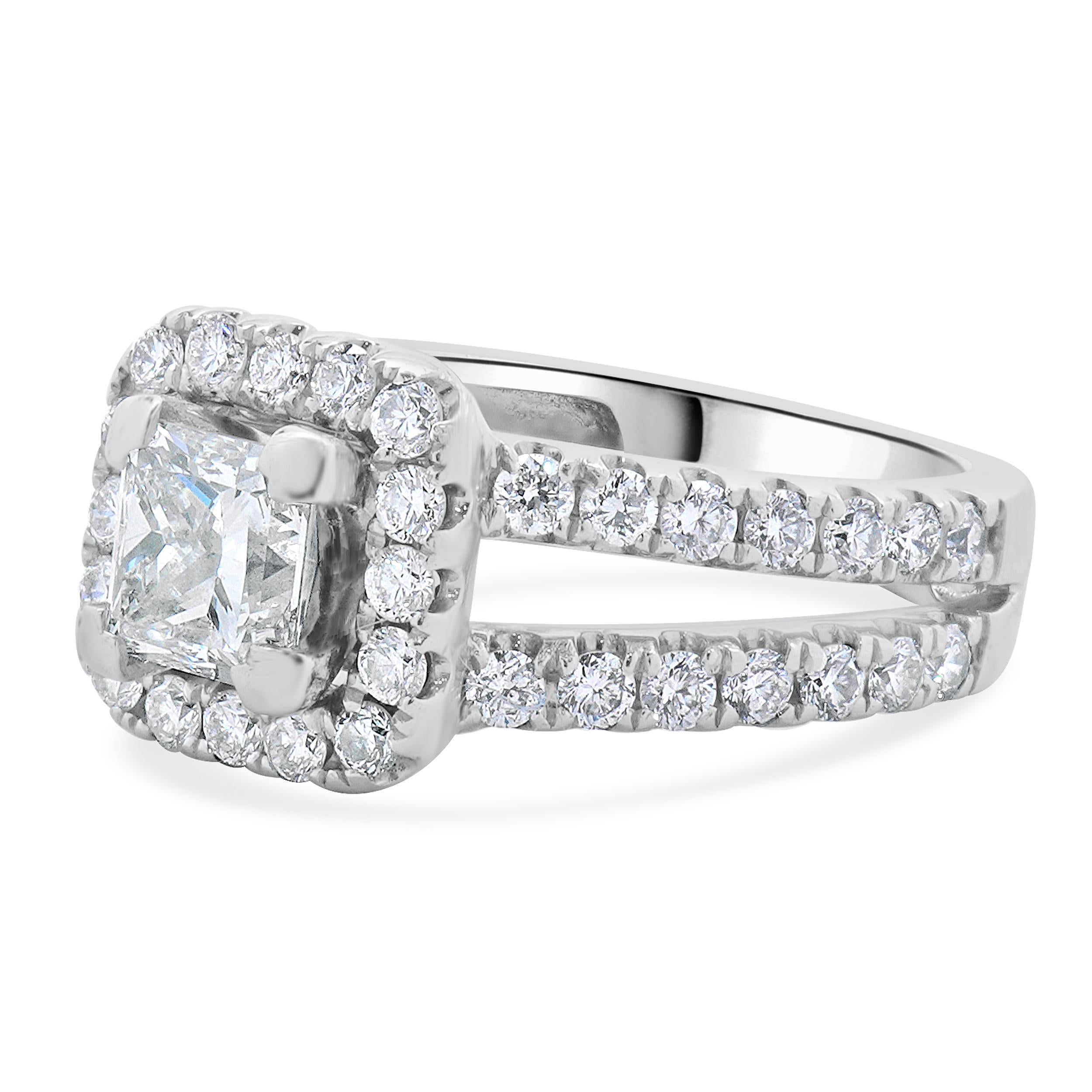 Designer: custom
Material: 14K white gold
Diamond: 1 princess cut = 0.78ct
Color: I
Clarity: VS1
Diamond: 56 round brilliant cut = 0.91cttw
Color: H
Clarity: SI1
Dimensions: ring top measures 9.8mm wide
Ring Size: 5 (complimentary sizing