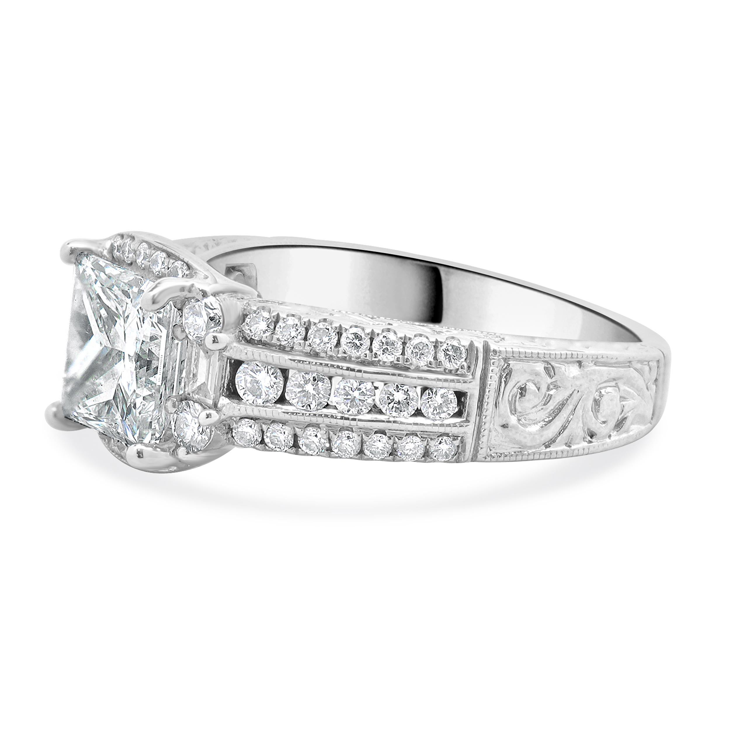 Designer: custom
Material: 14K white gold
Diamond: 1 princess cut = 1.52ct
Color: G
Clarity: SI1
GSI: 62595400113
Diamond: 52 round and baguette cut = 0.75cttw
Color: H
Clarity: SI2
Dimensions: ring top measures 14.9mm wide
Ring Size: 6
