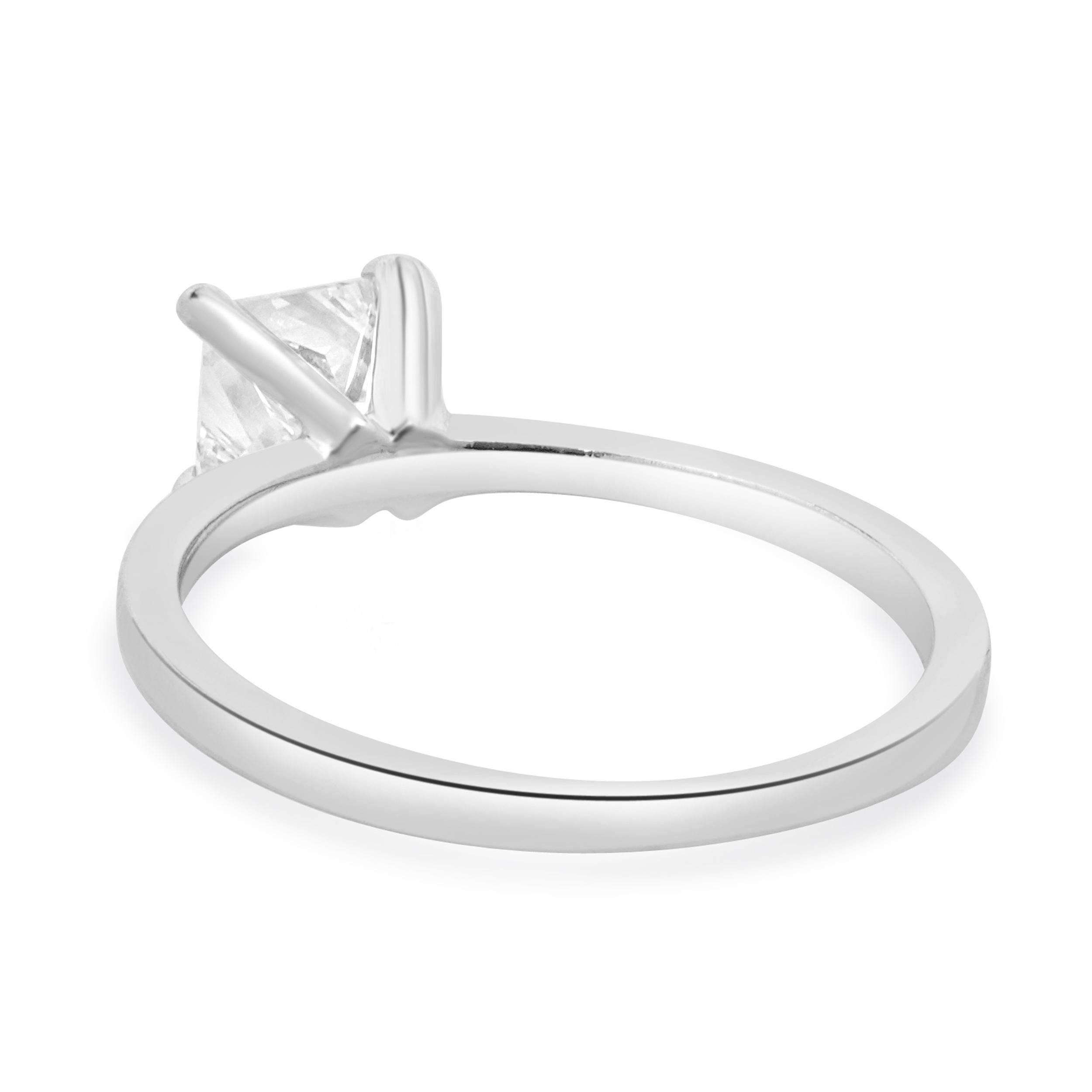 Designer: custom
Material: 14K white gold
Center Diamond: 1 princess cut = 0.74ct
Color : I
Clarity : VVS1
Size: 5.75 complimentary sizing available 
Weight: 1.96 grams