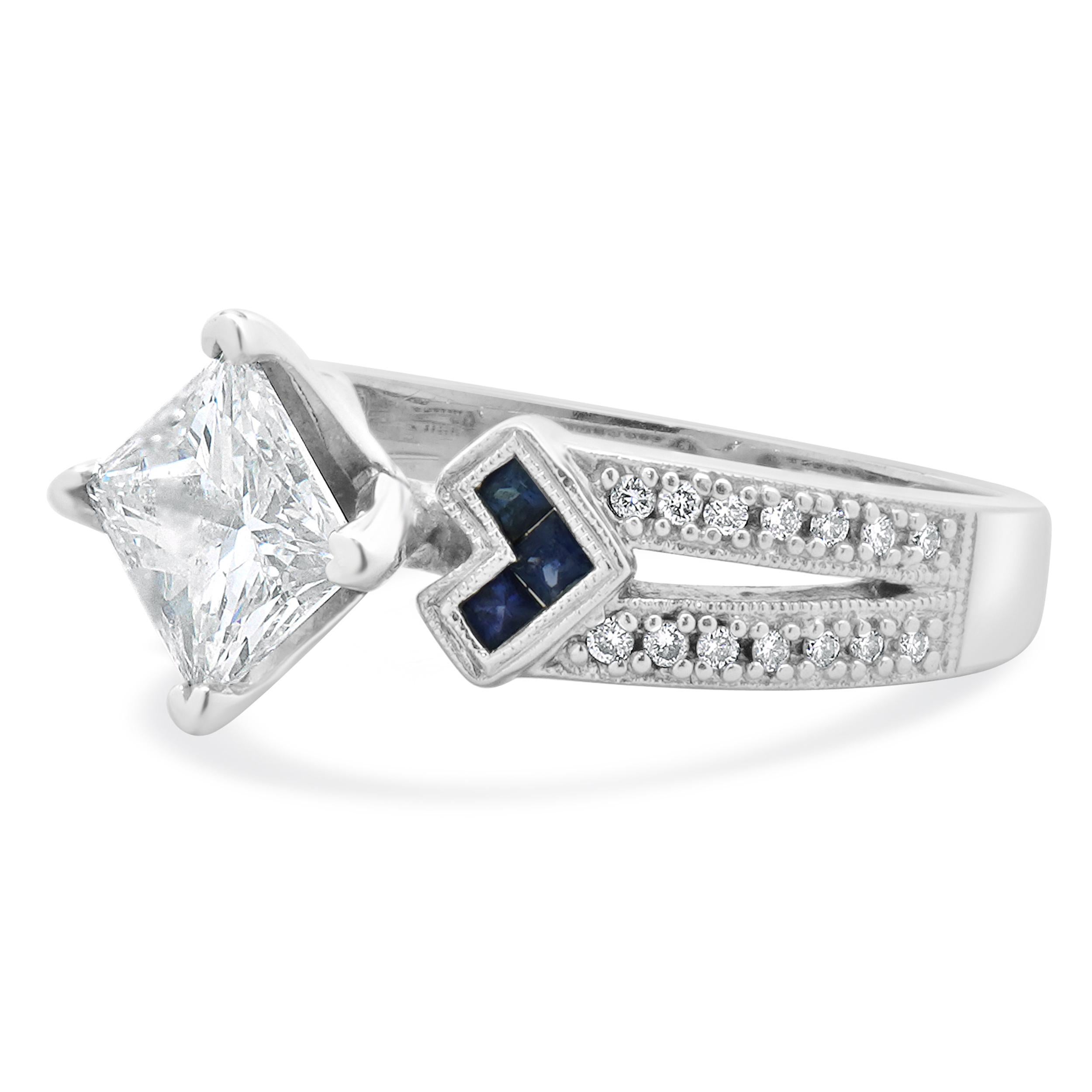Designer: custom
Material: 14K white gold
Center Diamond: 1 princess cut = 1.60ct
Color : I
Clarity : I1
Diamonds: 28 round brilliant cut = 0.11cttw
Color: I
Clarity: SI2
Size: 7.25 complimentary sizing available 
Weight: 5.75 grams