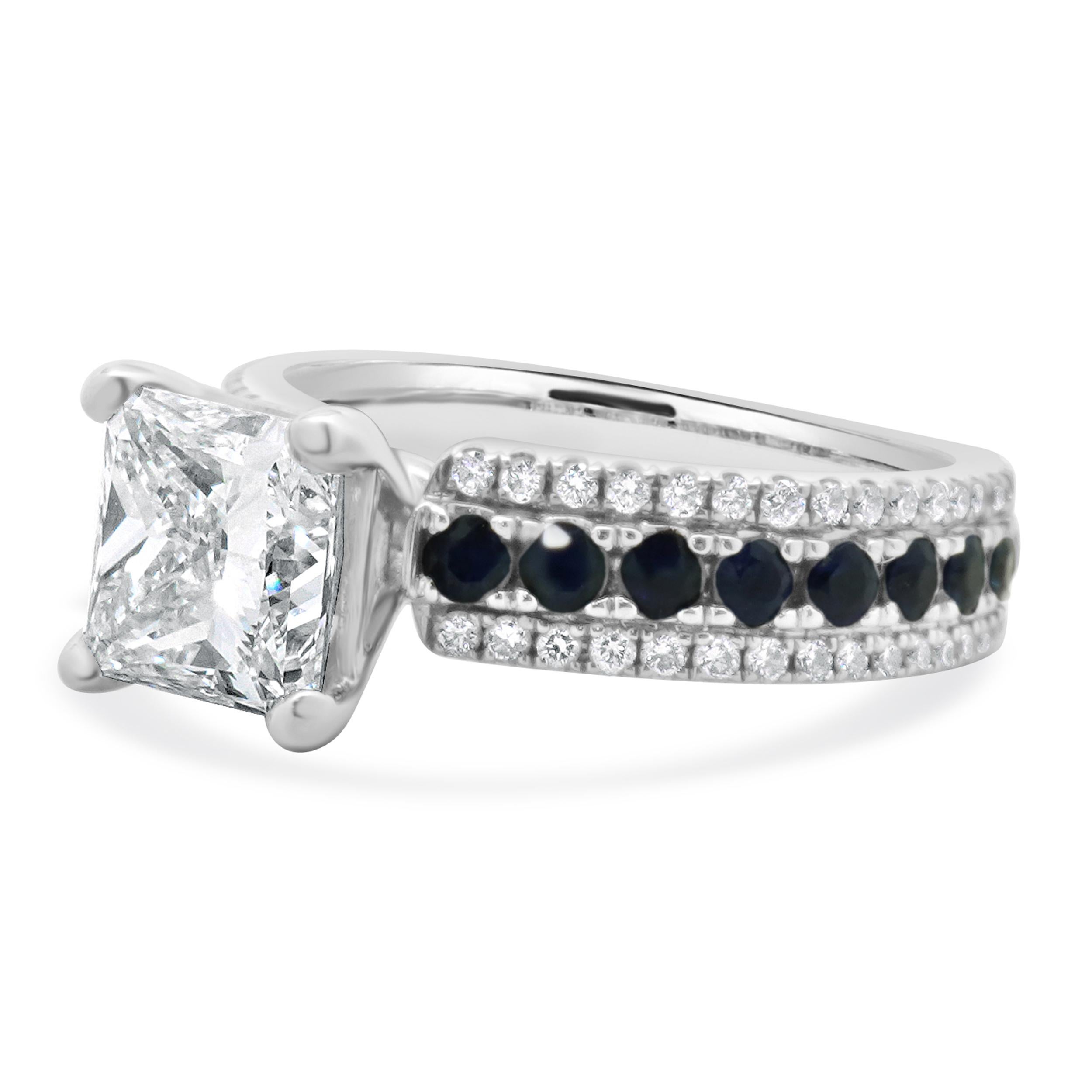 Designer: custom
Material: 14K white gold
Center Diamond: 1 princess cut = 1.85ct
Color : J
Clarity : VVS2 
GIA: 7351806265
Diamonds: 68 round brilliant cut = 0.25cttw
Color: G/H
Clarity: SI1
Sapphire: 18 round cut = 0.72cttw
Size: 4.25