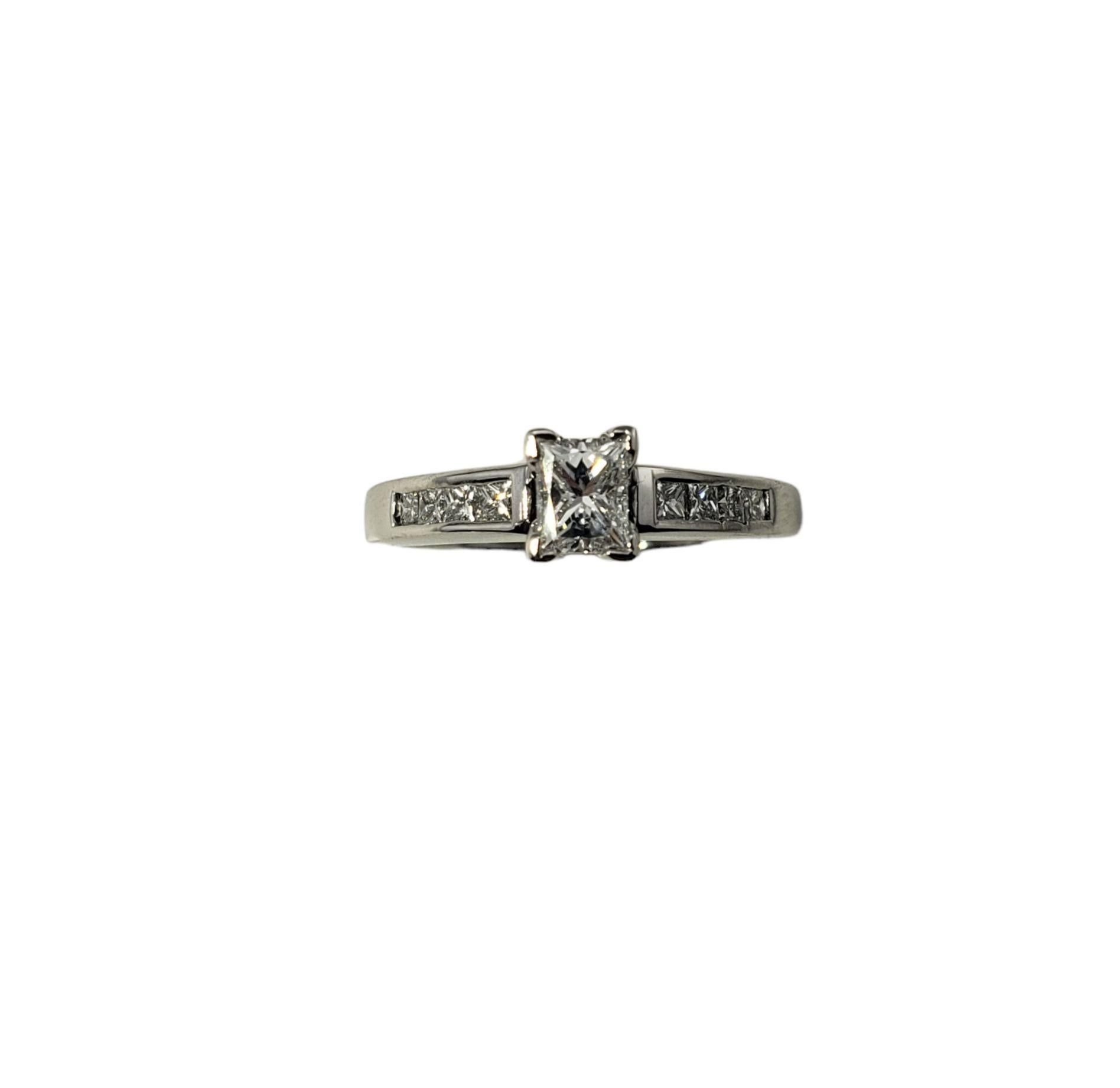 Vintage 14 Karat White Gold Princess Cut Diamond Engagement Ring Size 5.75-

This sparkling engagement ring features nine princess cut diamonds (center: .25 ct.) set in classic 14K white gold. Shank: 2 mm.

Approximate total diamond weight: .41