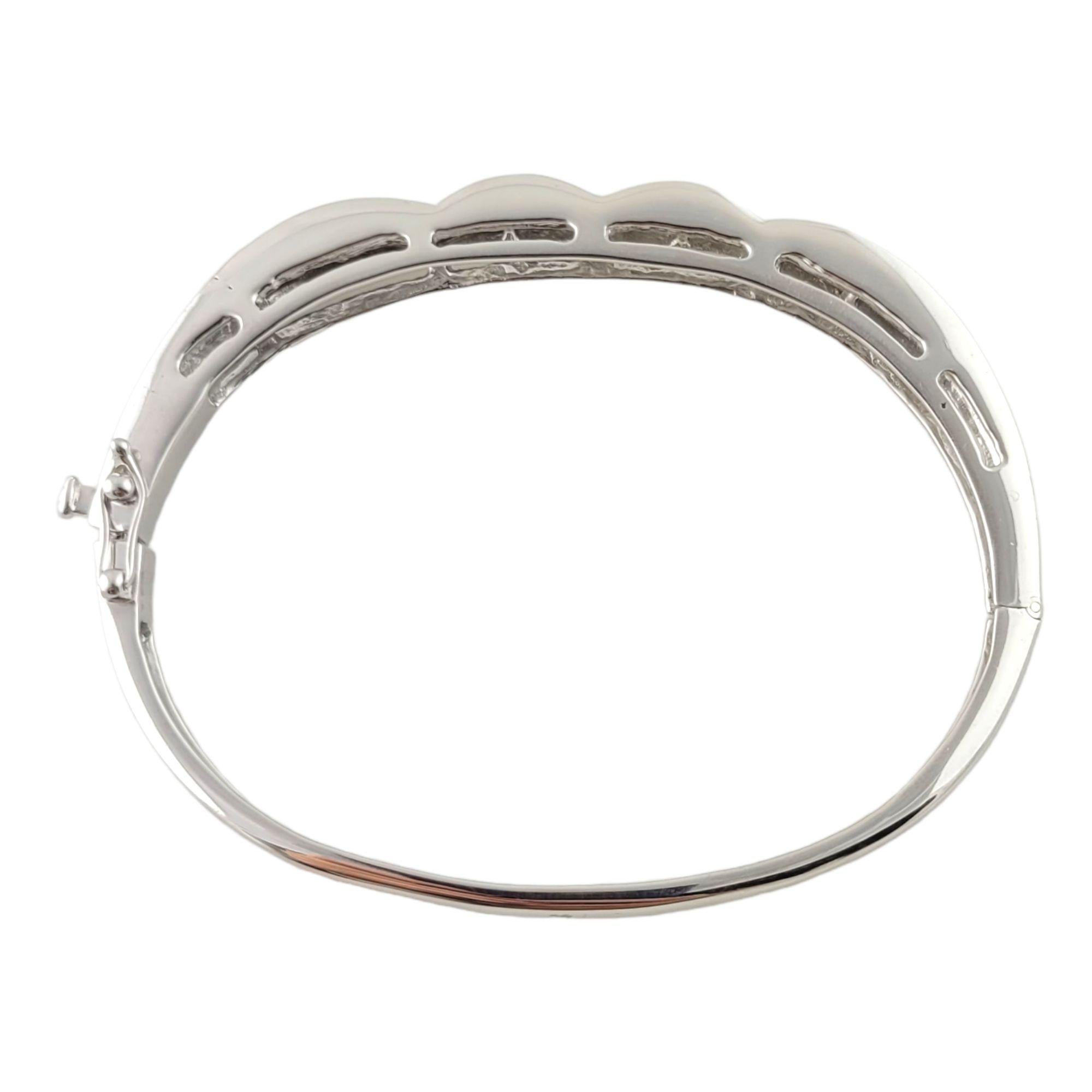 14K White Gold Diamond Bangle Bracelet

This sparkling diamond bangle bracelet is set in 14K white gold.

The front of the bracelet is set with 68 princess cut diamonds totaling approx. 3.40 cts in total diamond weight

Diamond clarity is