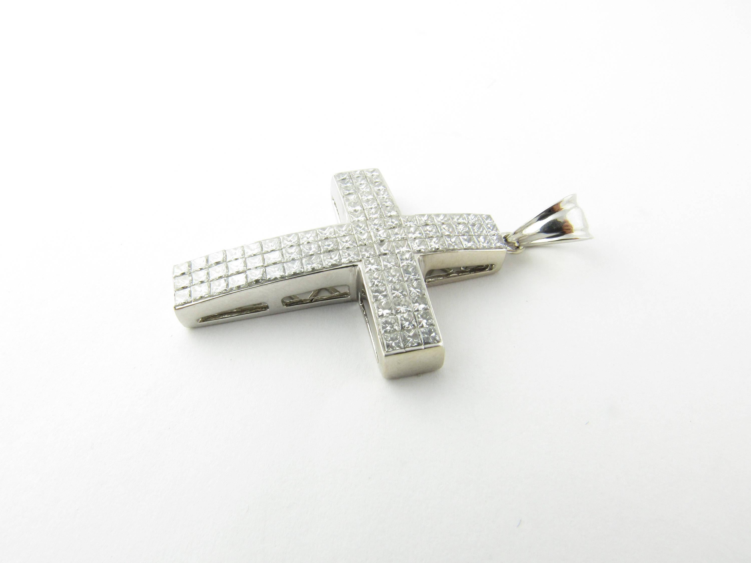 Vintage 14 Karat White Gold Princess Diamond Cross Pendant-

This spectacular cross pendant is crafted with 93 princess cut diamonds set in classic 14K white gold.

Approximate total diamond weight: 3 cts.

Diamond color: H

Diamond clarity:
