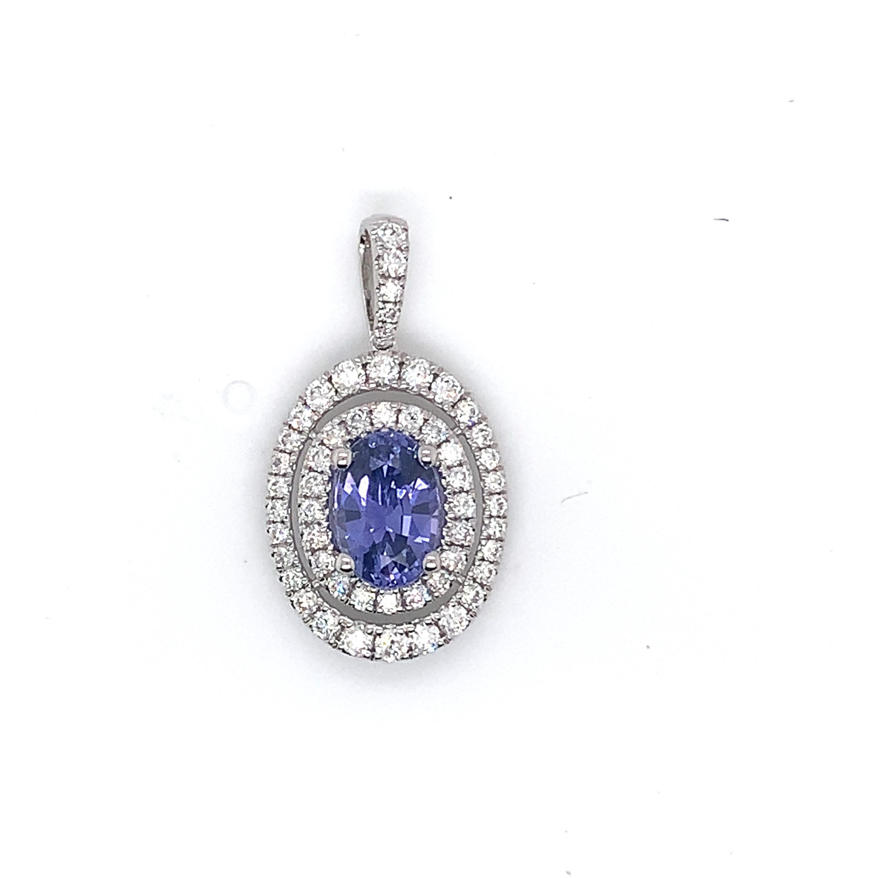 Purple Sapphire weighing 2.59 cts
53 round diamonds weighing .81 cts.
Set in 14k white gold pendant