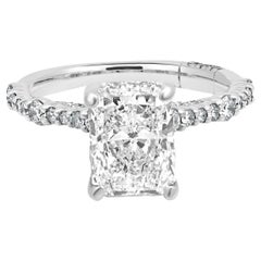 14 Karat White Gold Radiant Cut and Round Diamond Hidden Halo Engagement Ring