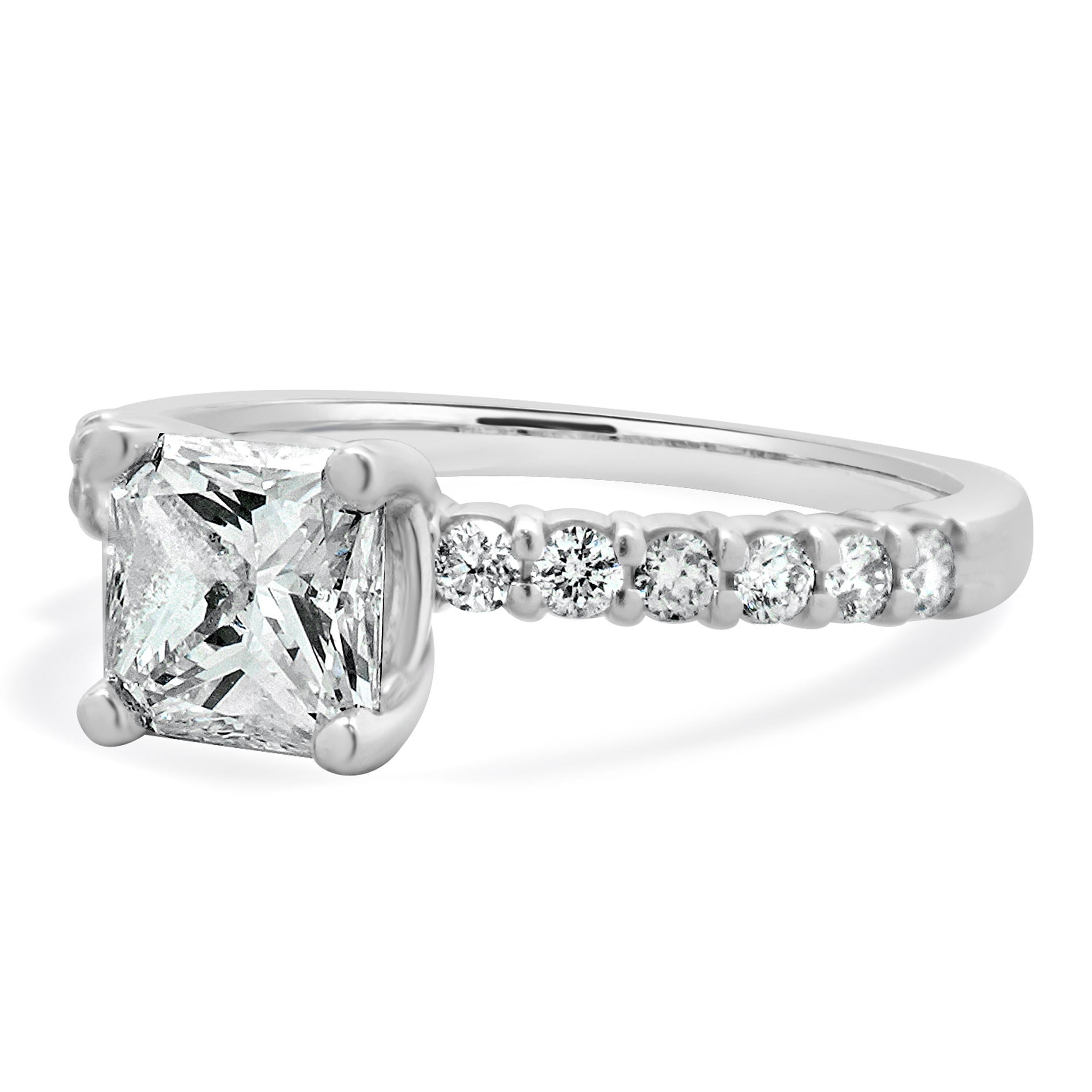 Designer: custom
Material: 14K white gold
Center Diamond: 1 radiant cut = 0.85ct
Color : F
Clarity : SI1
Diamond: 12 round brilliant cut = 0.24cttw
Color : G
Clarity : SI2
Size: 4 complimentary sizing available 
Weight: 1.97 grams