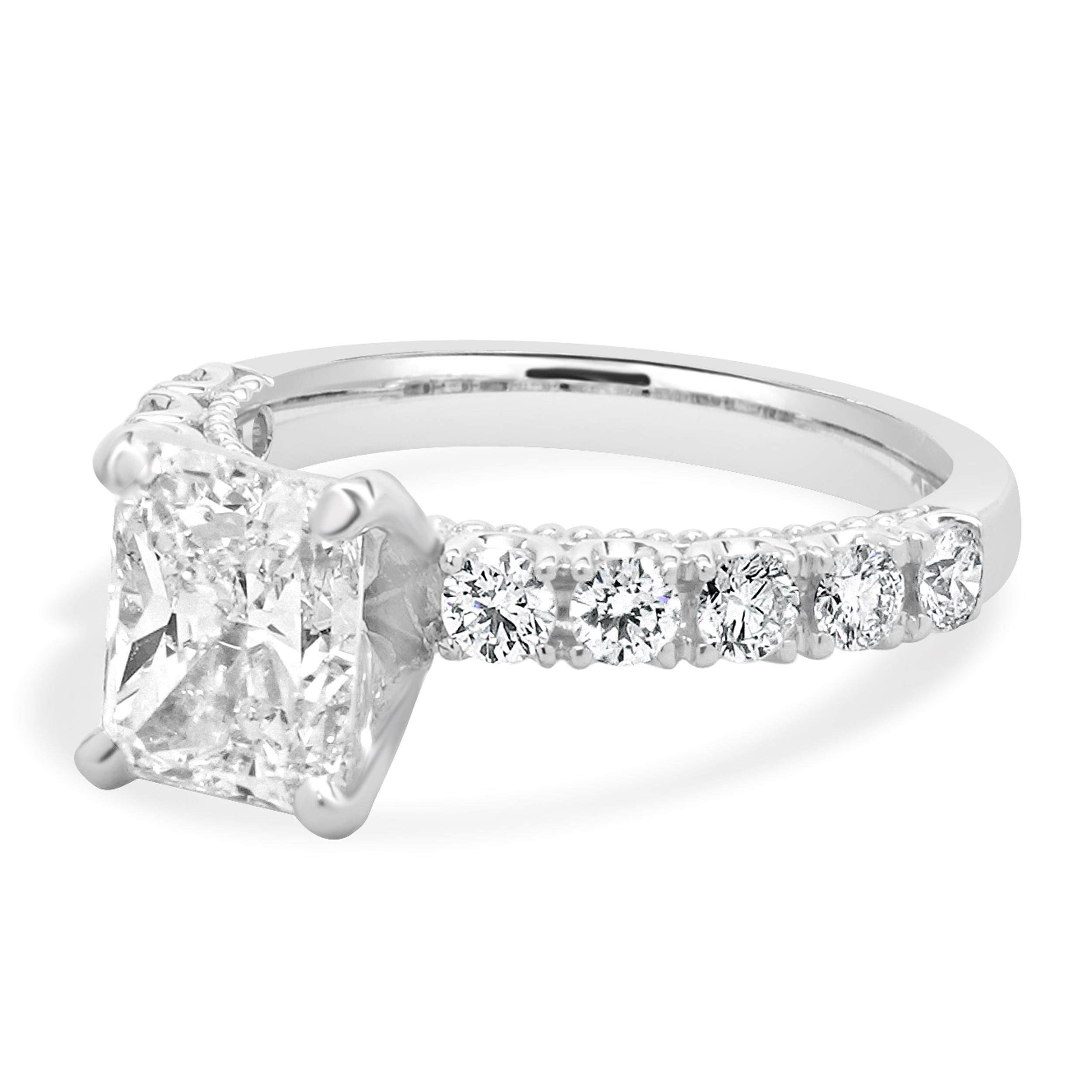 Material: 14K white gold
Center Diamond: 1 radiant cut = 2.02ct
Color: J
Clarity: SI2
GIA: 5231372979
Diamond: 10 round brilliant cut = 0.60cttw
Color: H
Clarity: SI2
Ring Size: 5.5 (please allow up to 2 additional business days for sizing