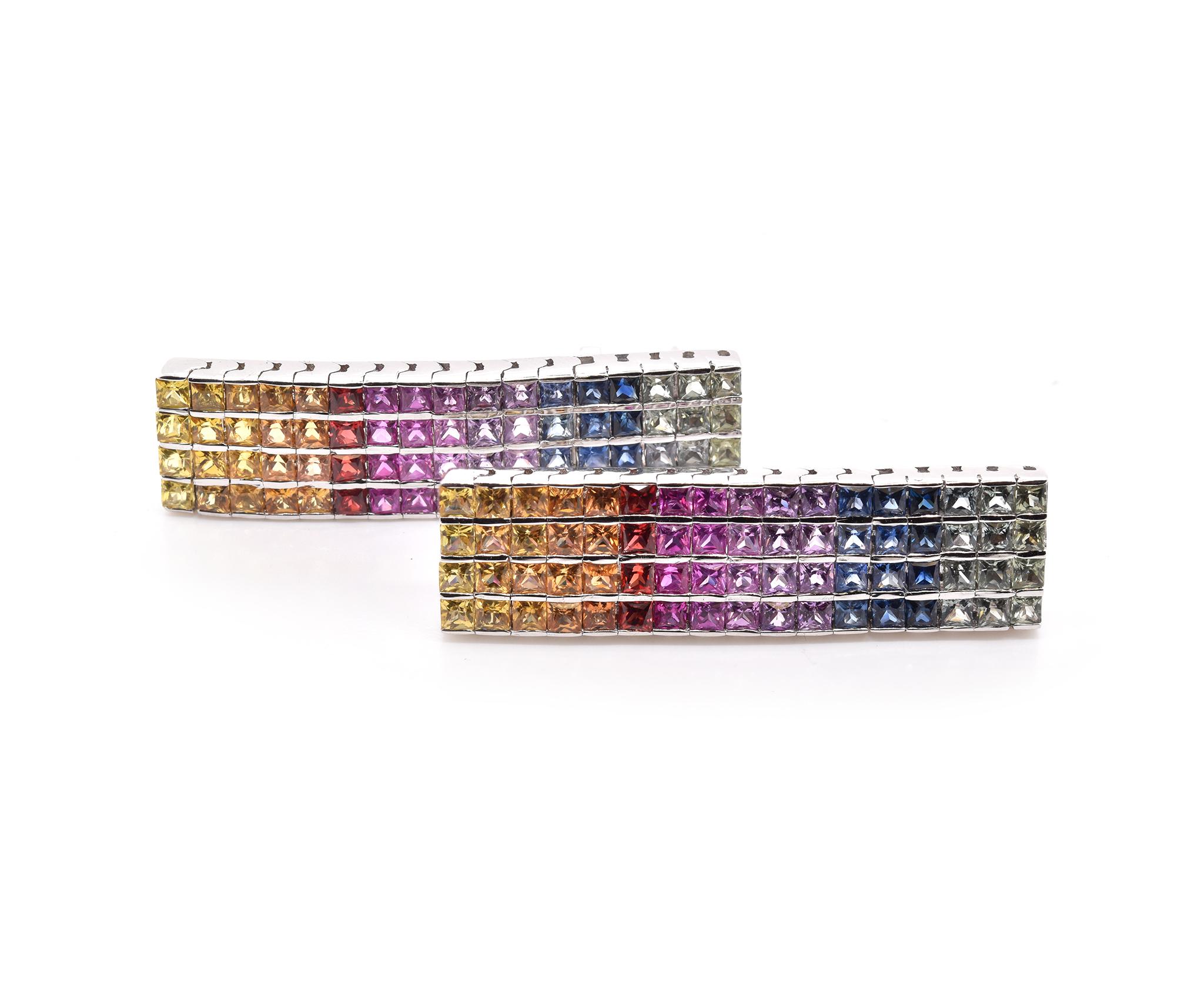 Material: 14K white gold
Diamond: 136 princess cut = 13.60cttw
Color: Rainbow
Clarity: AAA+
Fastenings: post with omega back
Measurements: earrings measure 36.6 X 10mm wide
Weight: 13.37 grams	

