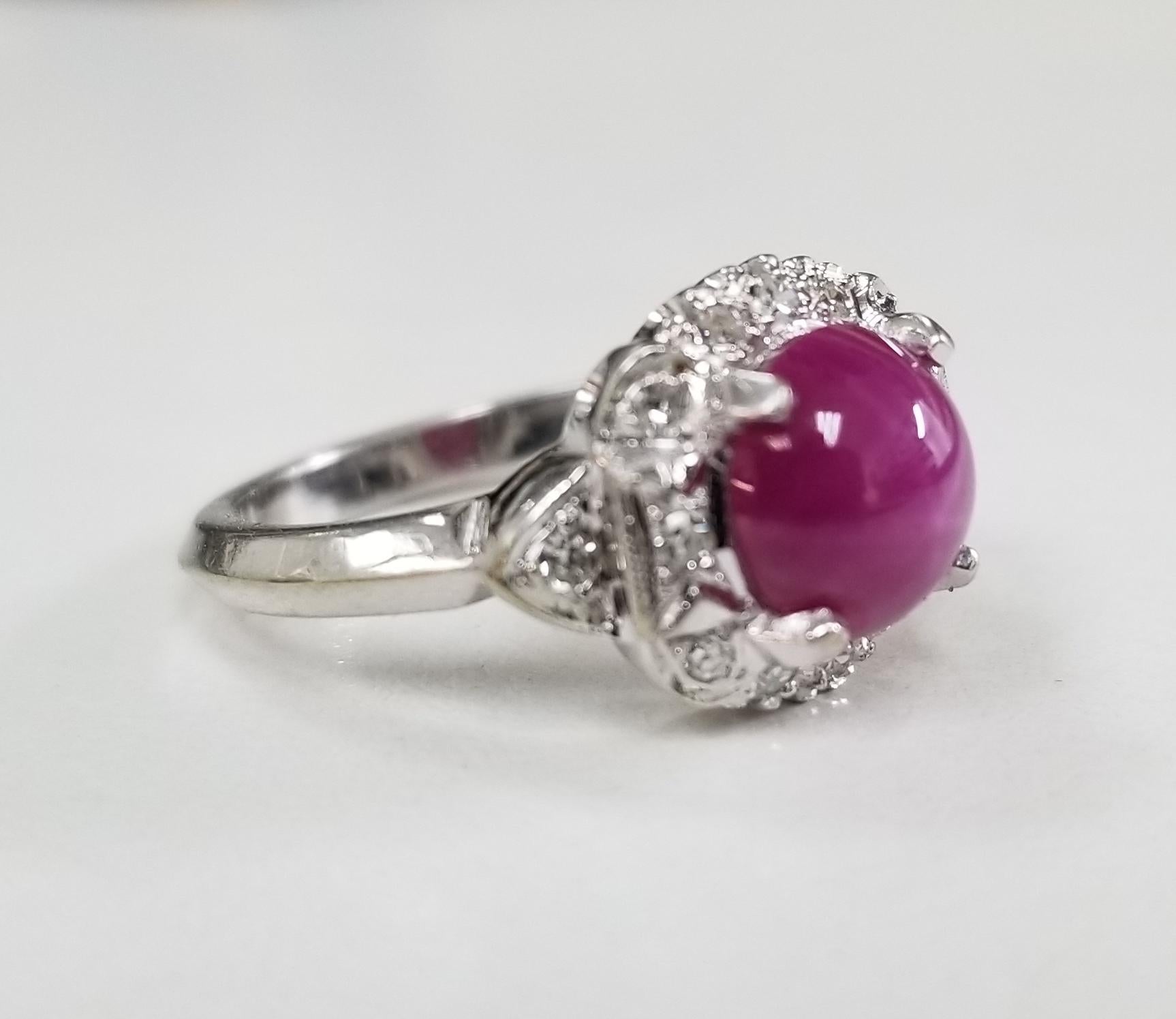  This is a 14k white gold ring with Pink Linde Star Sapphire in center and approximately 2.50ct diamonds.  The ring is currently 6 in US size, but I can get it resized a bit. 
Specifications:
    main stone: Pink Linde Star Sapphire 2.50CT
   