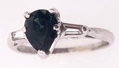 14 Karat White Gold Ring with Center Pear Shape Sapphire And Diamond Accents