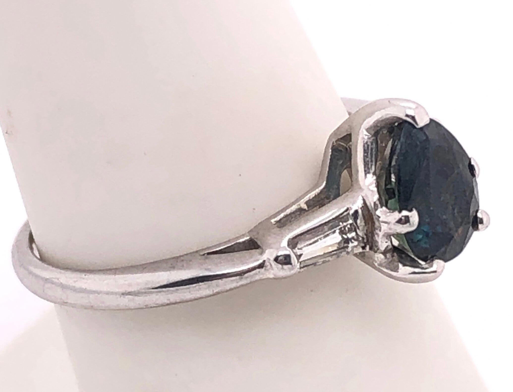 Pear Cut 14 Karat White Gold Ring with Center Pear Shape Sapphire And Diamond Accents For Sale