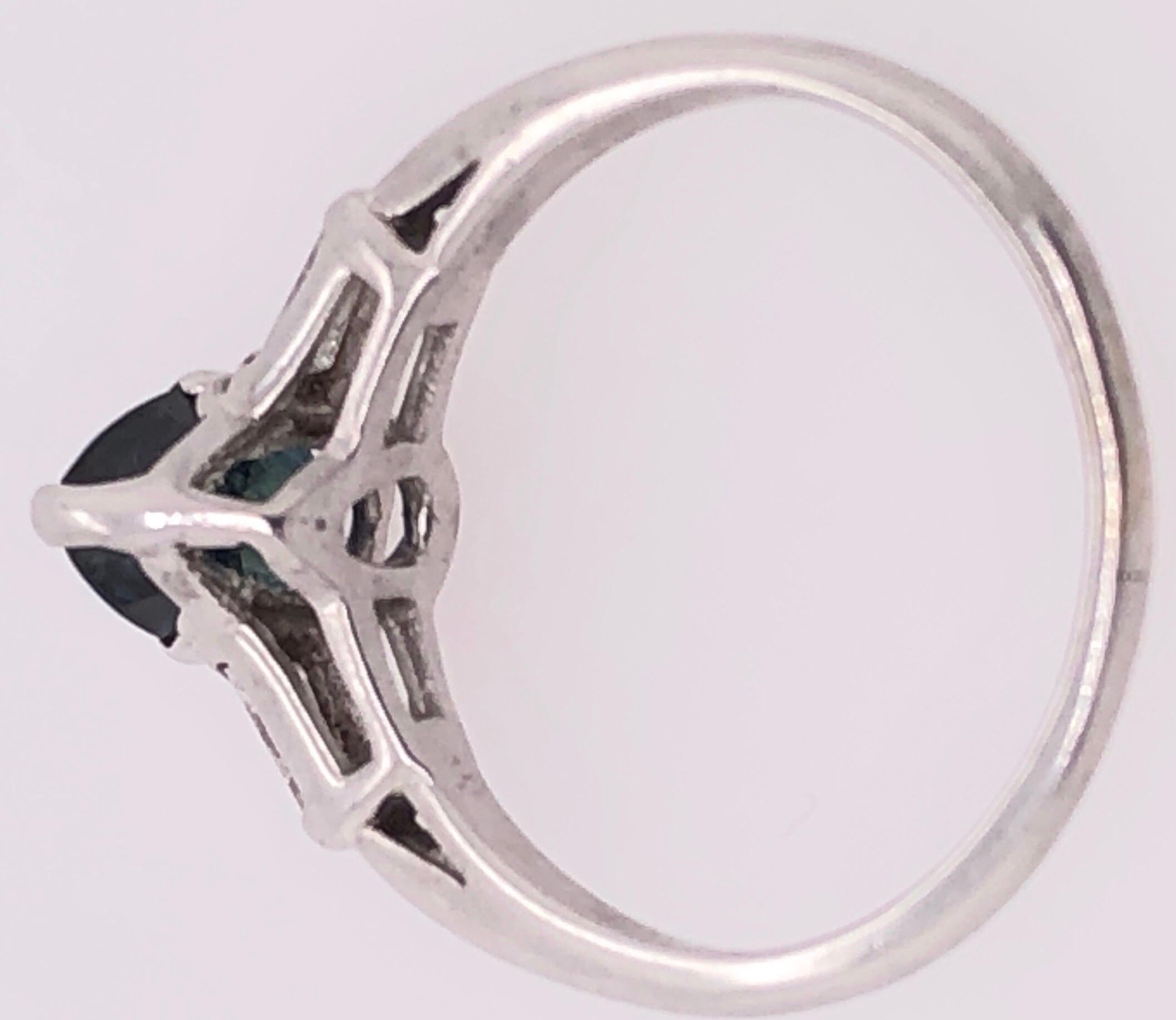 14 Karat White Gold Ring with Center Pear Shape Sapphire And Diamond Accents In Good Condition For Sale In Manhasset, NY