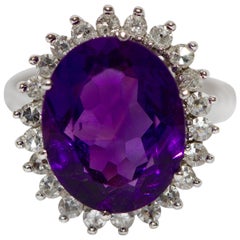 14 Karat White Gold Ring with Faceted, Strong Amethyst and Many Diamonds