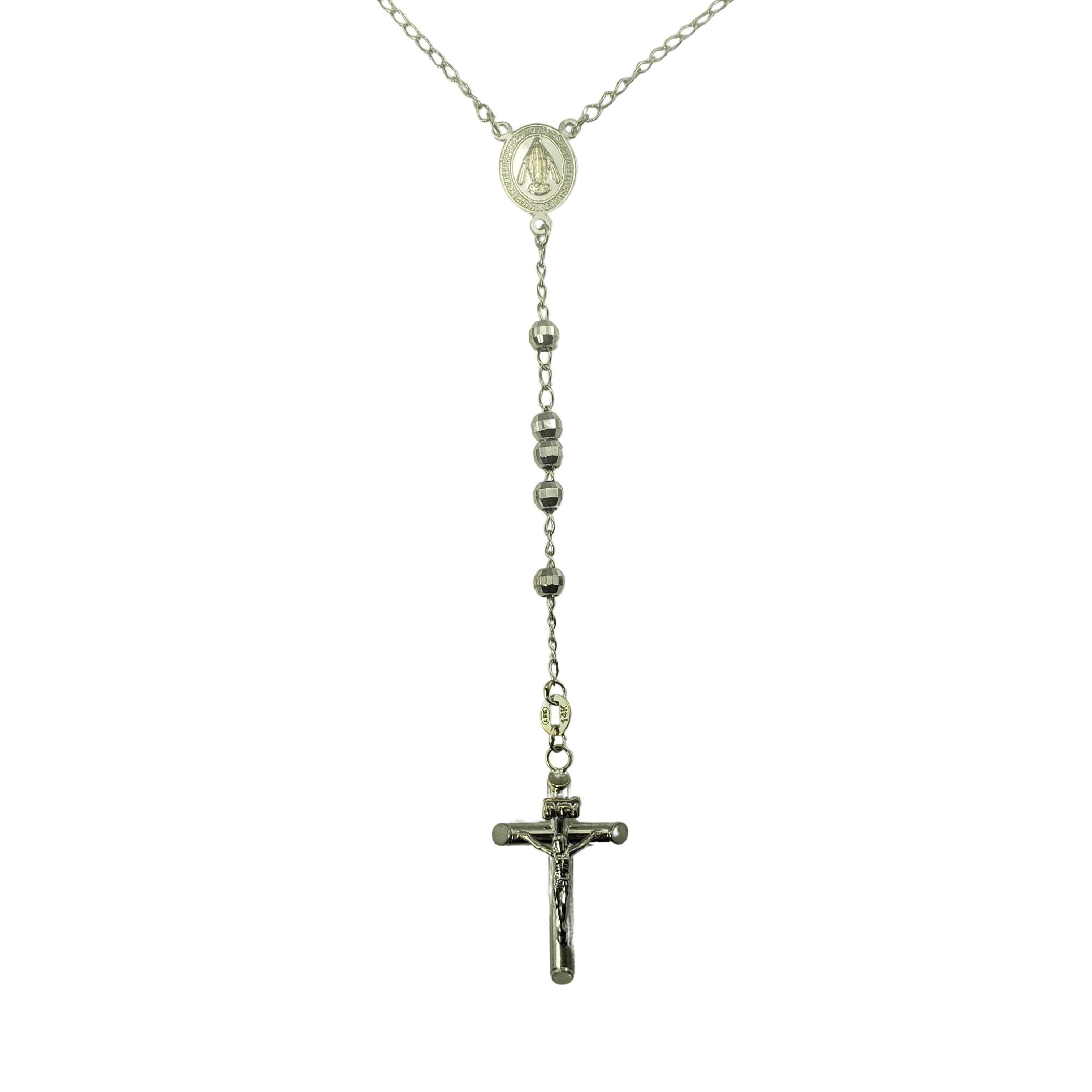 14 Karat White Gold Rosary Beads-

These beautiful rosary beads are crafted in beautifully detailed 14K white gold.

Size: 17.5 inches 
         27 mm x 16 mm (cross)
         4 mm (bead width)

Weight:  12.7 dwt. /  8.1 gr.

Stamped: 14K

Very good