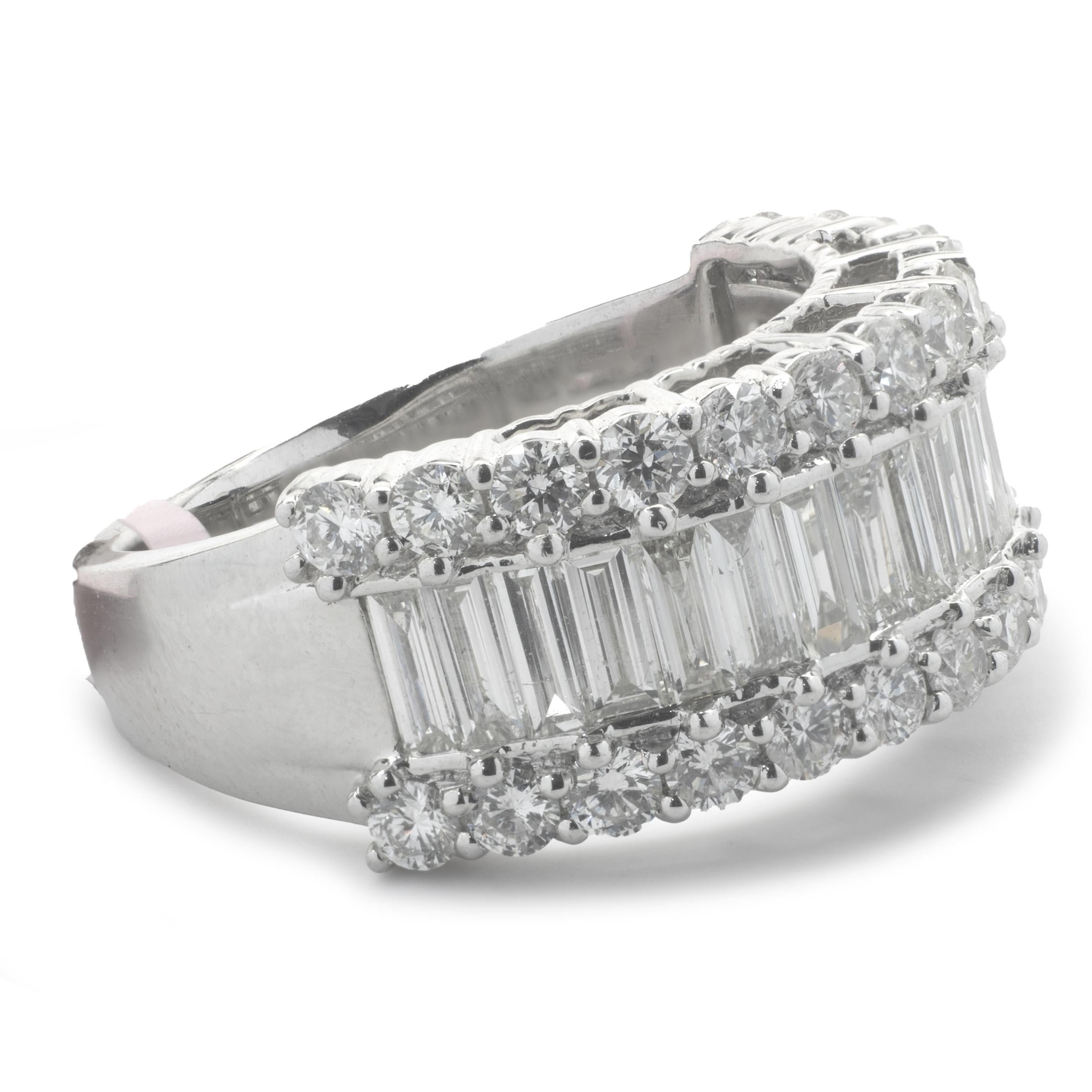 Designer: custom
Material: 14K white gold
Diamond: 48 round brilliant and baguette diamonds= 2.69cttw
Color: G
Clarity: VS
Ring size: 7.5 (please allow two additional shipping days for sizing requests)
Weight:  8.6 grams
