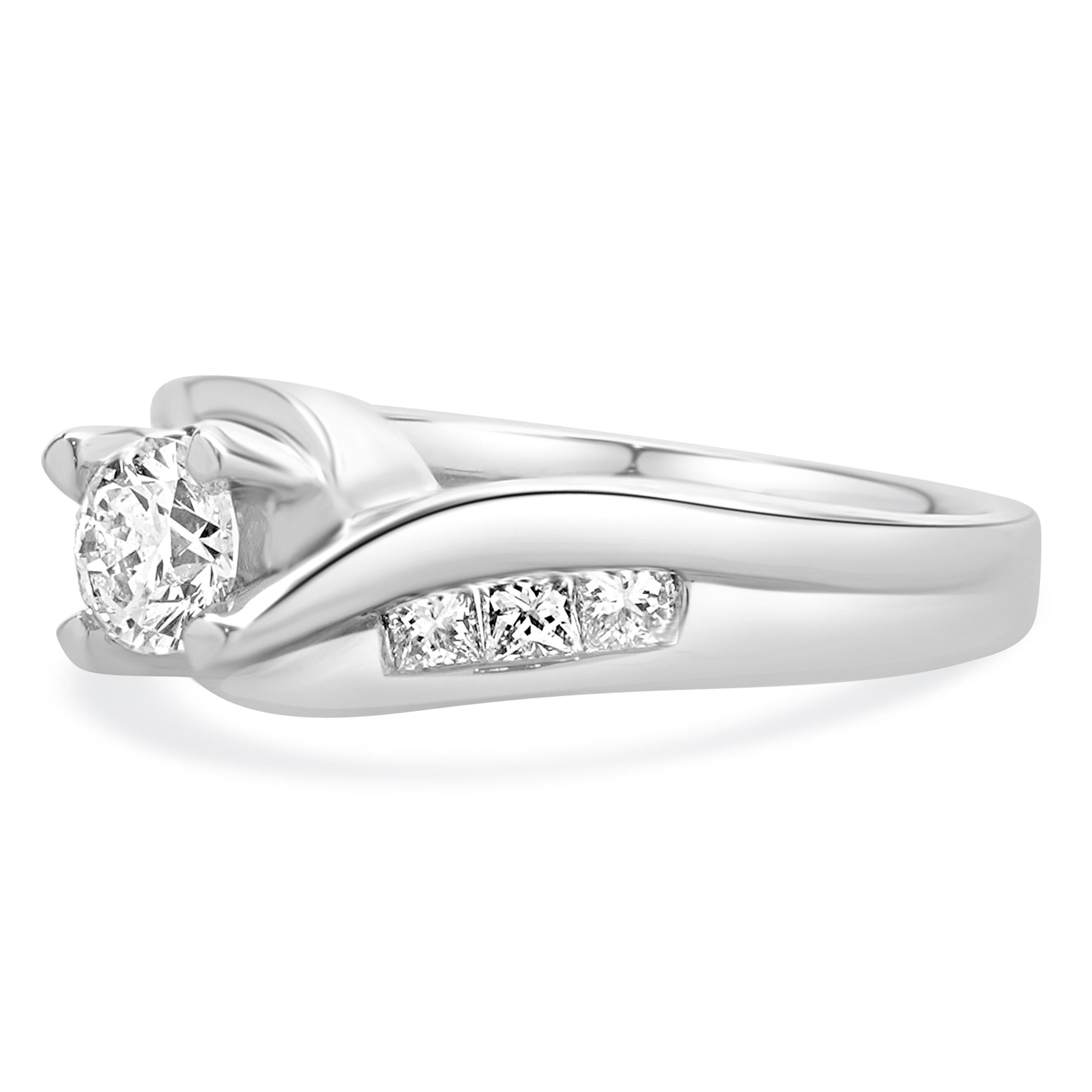 Material: 14K white gold
Diamond: 1 round brilliant cut = 0.38ct
Color: G
Clarity: SI2
Diamond: 6 princess cut = 0.42cttw
Color: I
Clarity: SI1
Ring Size: 6.25 (please allow up to 2 additional business days for sizing requests)
Dimensions: ring