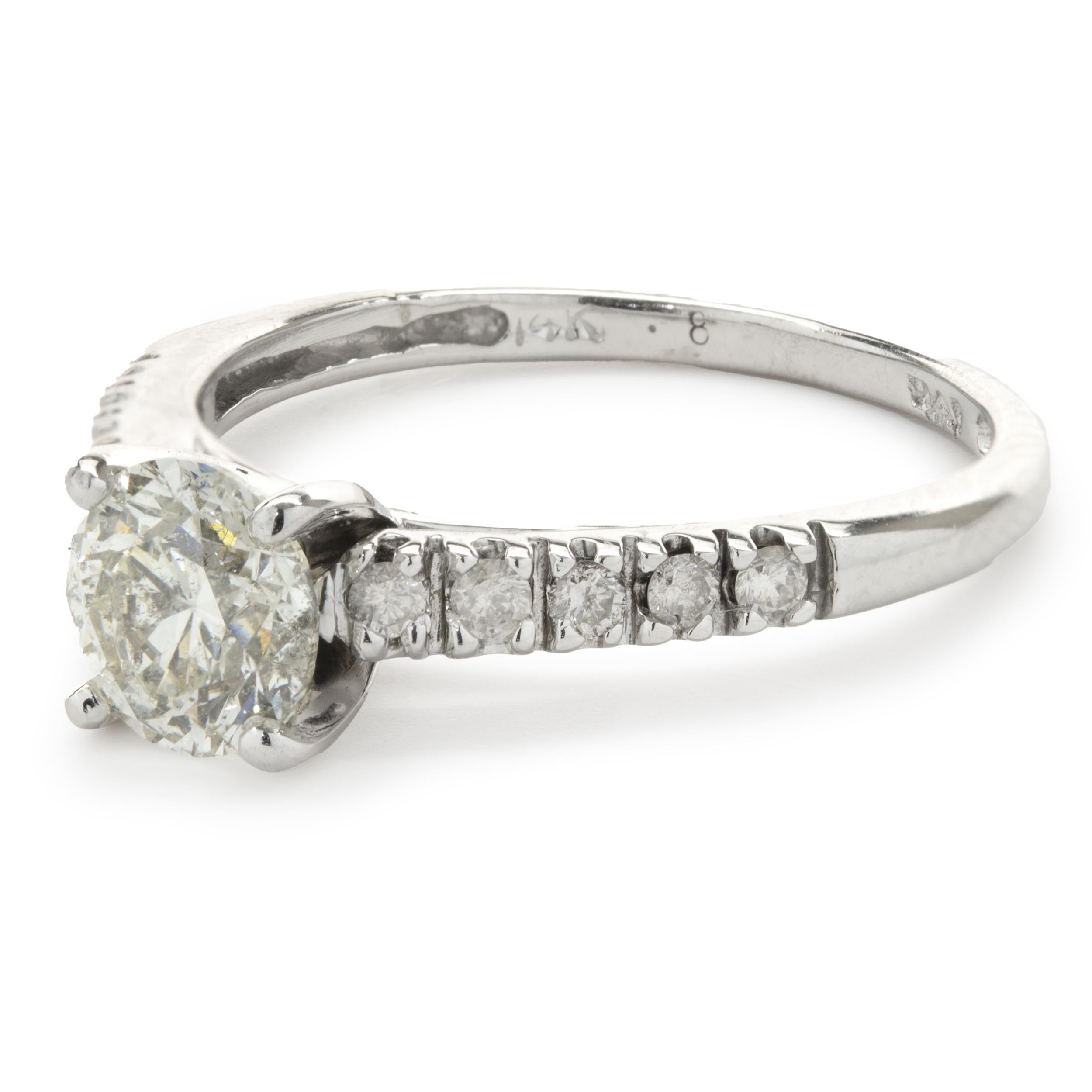 Designer: custom
Material: 14K white gold
Diamond: 1 round brilliant cut = 0.75ct
Color: H
Clarity: SI2
Diamond: 10 round cut = .20cttw
Color: G
Clarity: SI1
Ring Size: 5.5 (please allow up to 2 additional business days for sizing