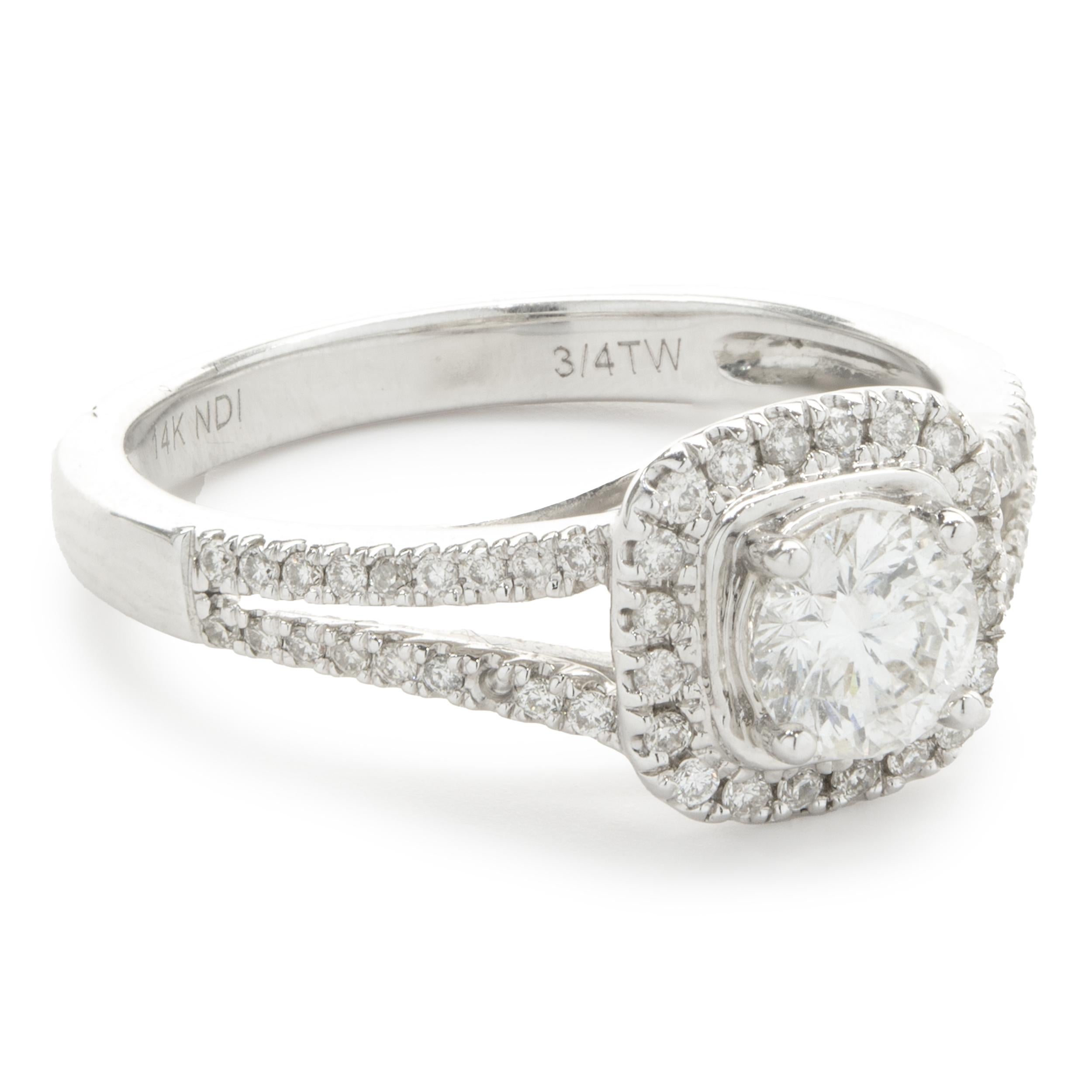 Designer: custom
Material: 14K white gold
Center Diamond: 1 round brilliant cut = 0.50ct
Color: H
Clarity: I1
Diamond: 56 round brilliant cut = 0.25cttw
Color: G
Clarity: SI1
Ring Size: 7 (please allow two additional shipping days for sizing