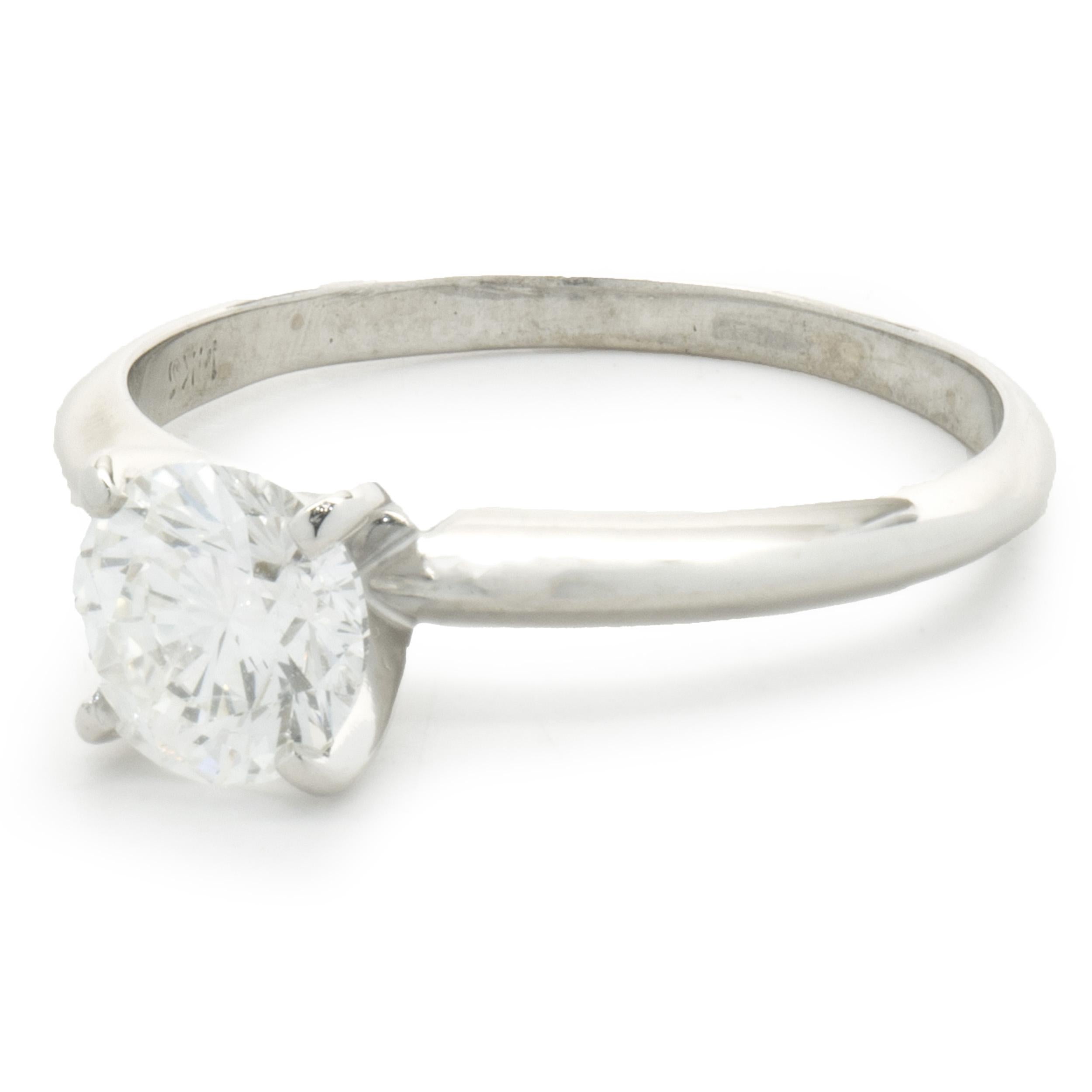 Designer: Custom
Material: 14K white gold
Diamonds: 1 round brilliant cut = 0.95ct
Color: G
Clarity: SI2
Dimensions: ring top measures 2.3mm wide
Ring Size: 7.75 (complimentary sizing available)
Weight: 2.37 grams