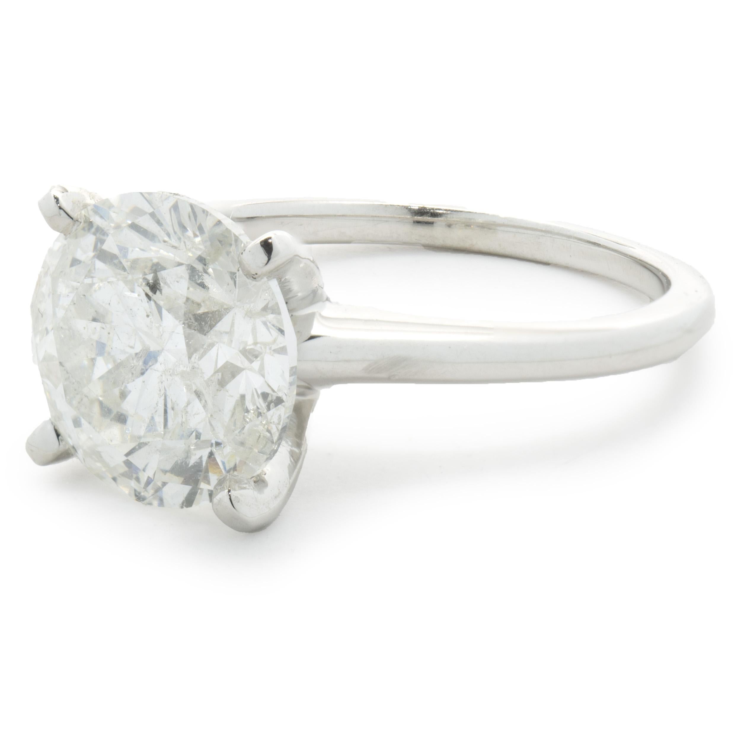 Designer: Custom
Material: 14K white gold
Diamond: 1 round brilliant cut = 4.50ct
Color: H
Clarity: I1
Dimensions: ring top measures 10.25mm wide
Ring Size: 7 (complimentary sizing available)
Weight: 4.49 grams