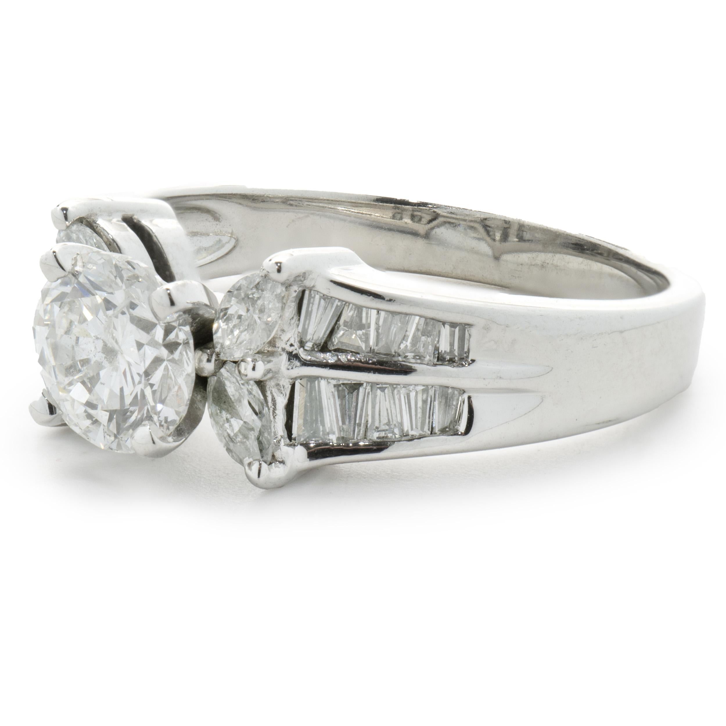 Designer: Custom
Material: 14K white gold
Diamond: 1 round brilliant cut = 0.93ct
Color: I
Clarity: I1
Diamond: 26 marquise & baguette cut = 0.75cttw
Color: H
Clarity: SI1
Dimensions: ring top measures 8mm wide
Ring Size: 8 (complimentary sizing