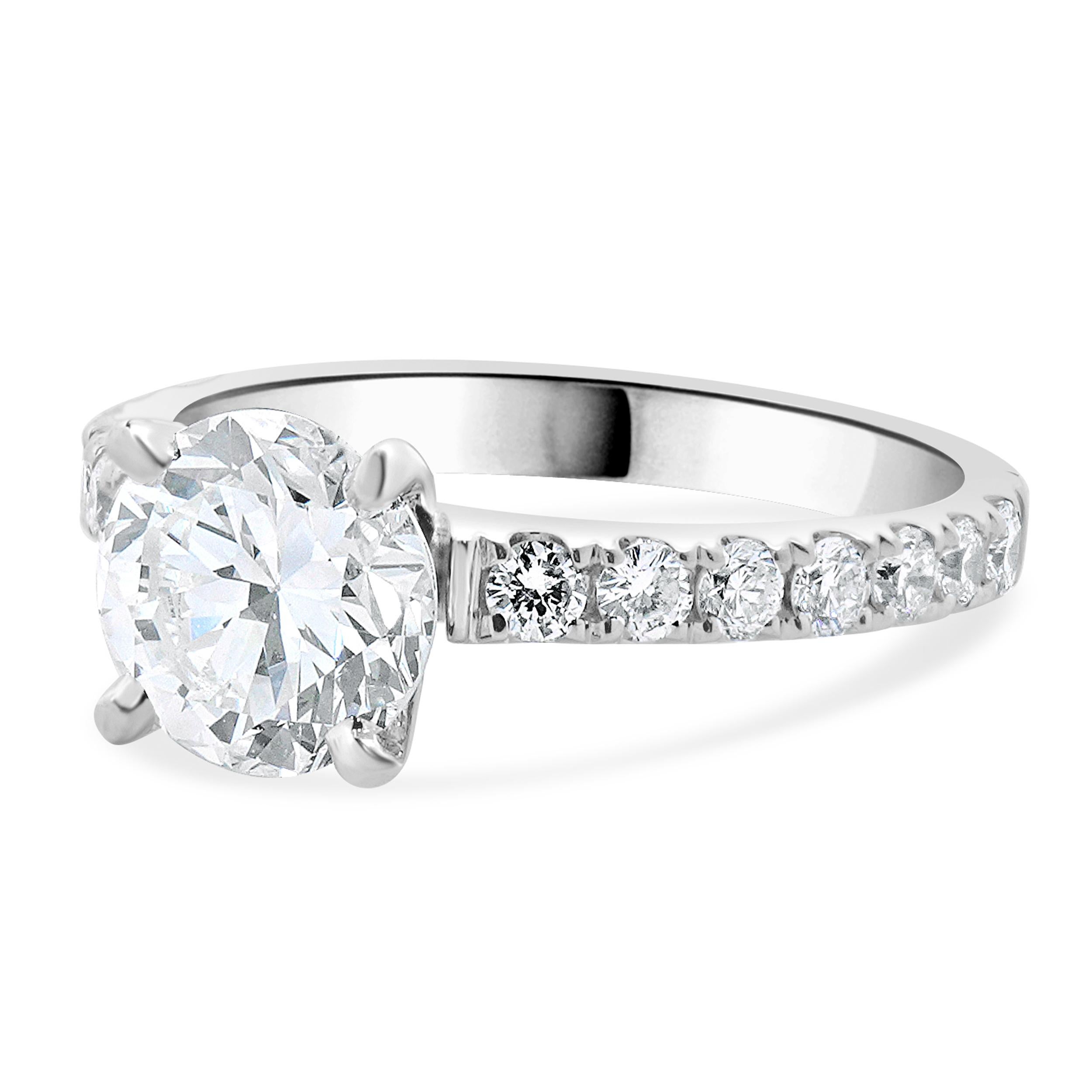 Designer: custom
Material: 14K white gold
Diamond: 1 round brilliant cut = 1.59ct
Color: F
Clarity: VS1
GIA: 2235050168
Diamond: 14 round brilliant cut = 0.42cttw
Color: G
Clarity: SI1
Dimensions: ring top measures 7.50mm wide
Ring Size: 6