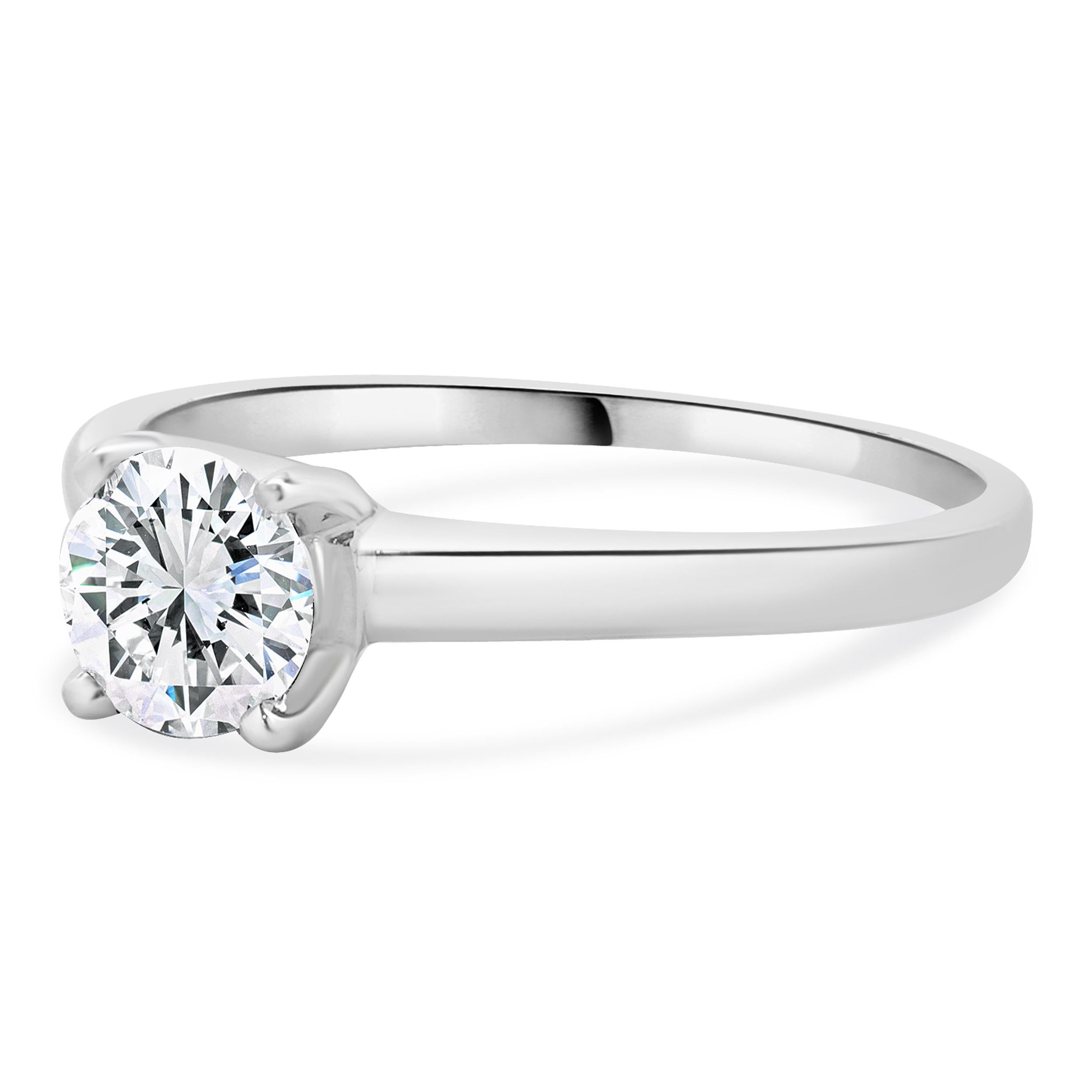 Designer: custom
Material: 14K white gold
Center Diamond: 1 round brilliant cut = 0.75ct
Color : G
Clarity : SI1
Size: 8.5 complimentary sizing available 
Weight: 2.59 grams
