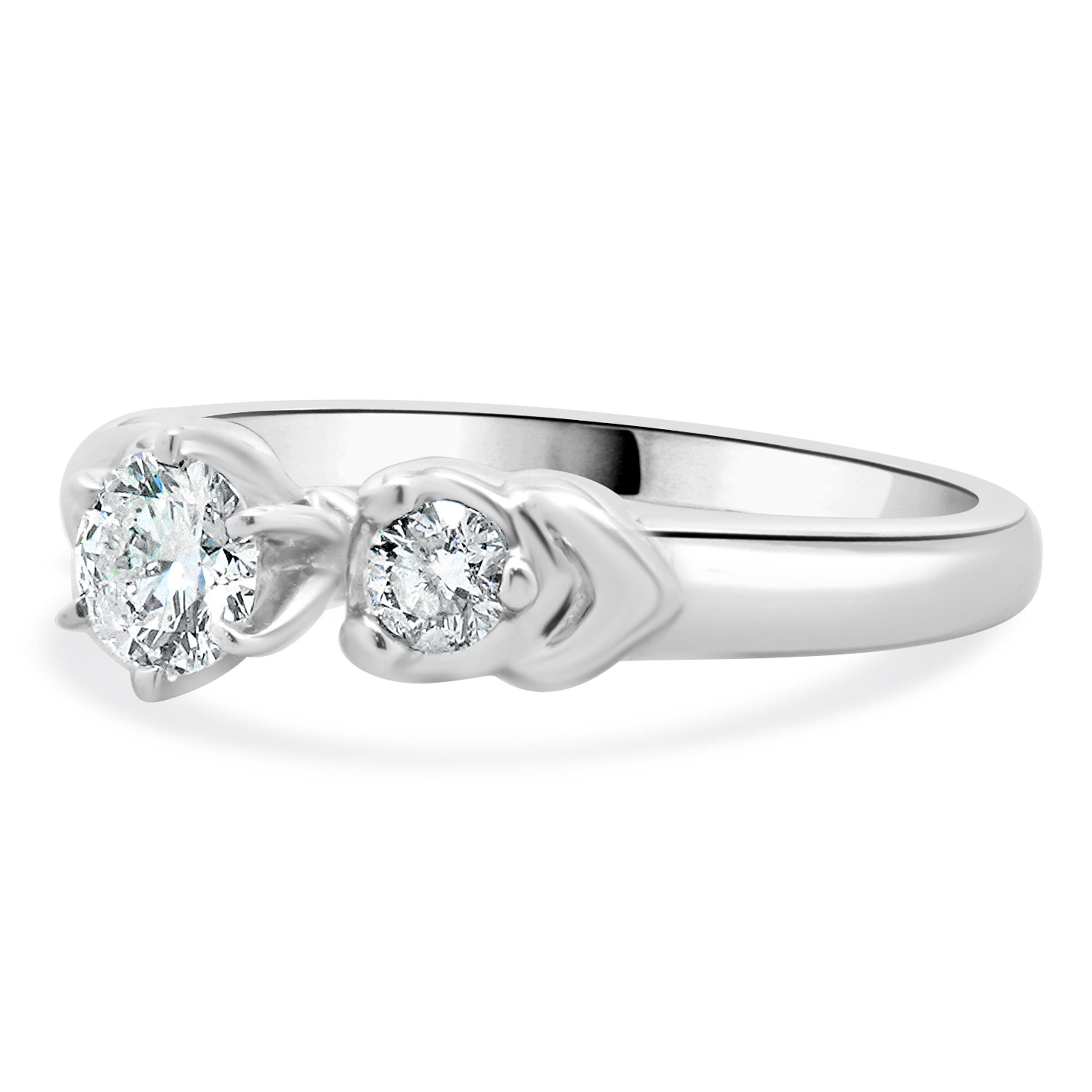 Designer: custom
Material: 14K white gold
Center Diamond: 1 round brilliant cut = 0.40ct
Color : G
Clarity : I1 
Diamonds: 2 round brilliant cut = 0.20cttw
Color: H
Clarity: SI1-2
Size: 7 complimentary sizing available 
Weight: 4.23 grams