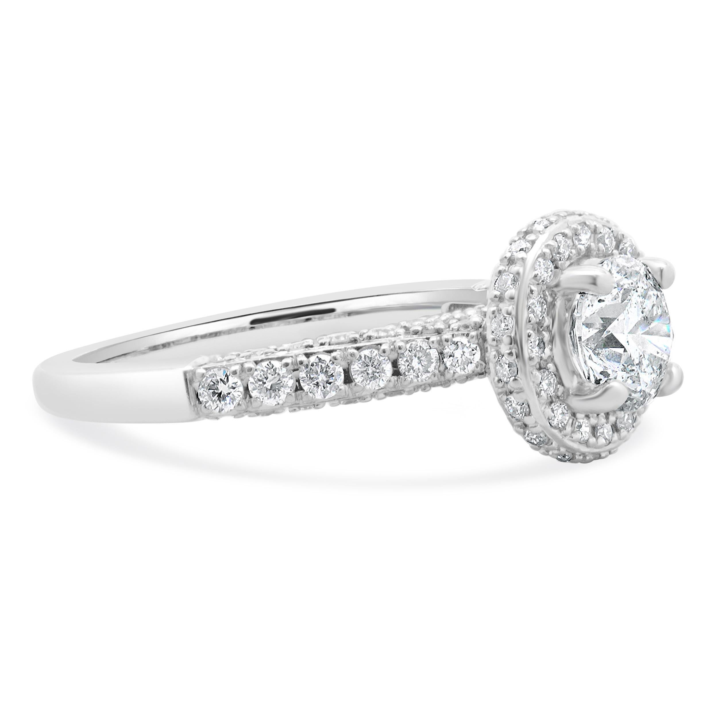 Designer: custom
Material: 14K white gold
Center Diamond: 1 round brilliant cut = 0.68ct
Color : H
Clarity : I1
Diamond: 88 round brilliant cut = 0.60cttw
Color : H/I
Clarity : SI2
Size: 6.25 complimentary sizing available 
Weight: 3.01 grams