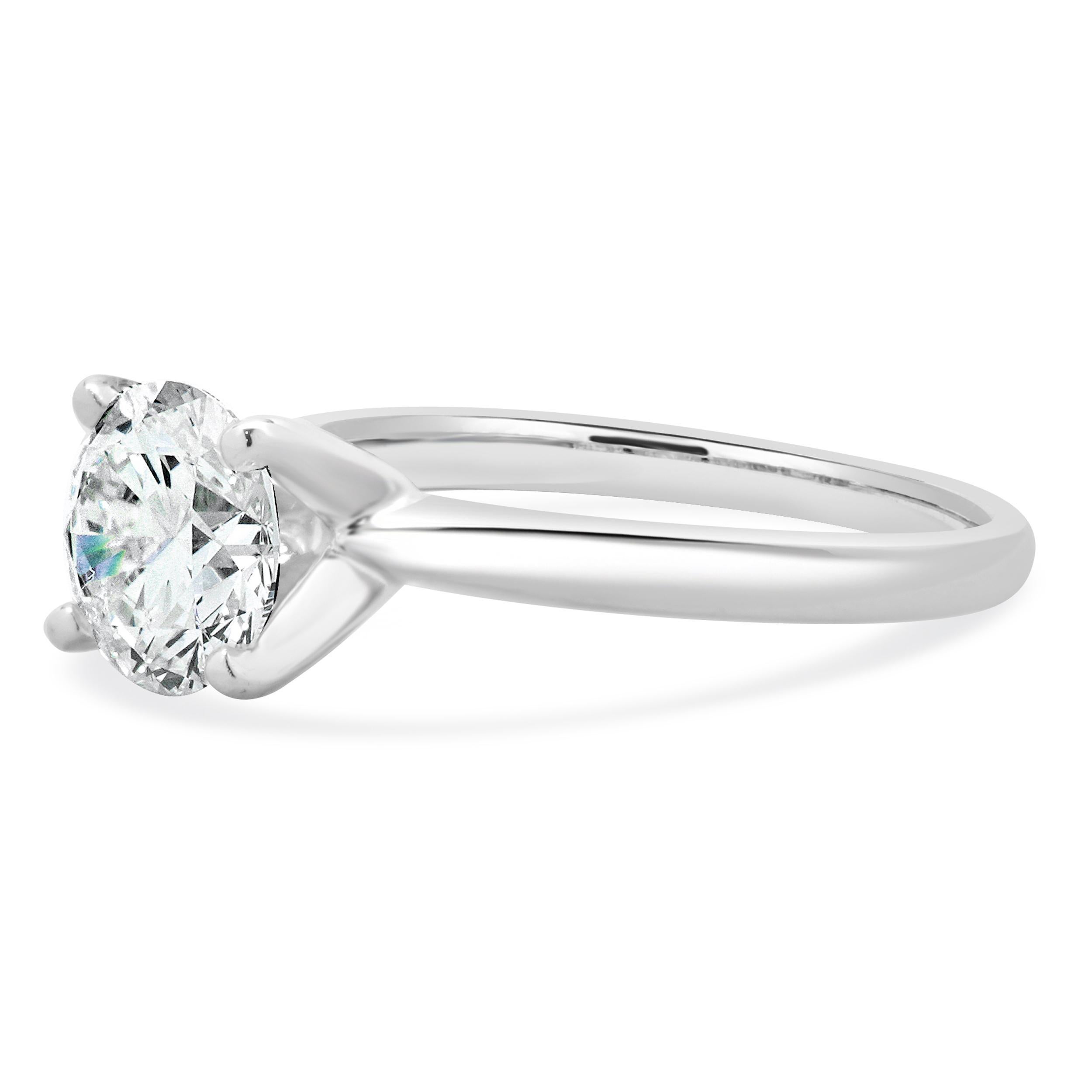 Designer: custom
Material: 14K white gold
Center Diamond: 1 round brilliant cut = 1.58ct
Color : H
Clarity : I1
Size: 7 complimentary sizing available 
Weight: 2.77 grams