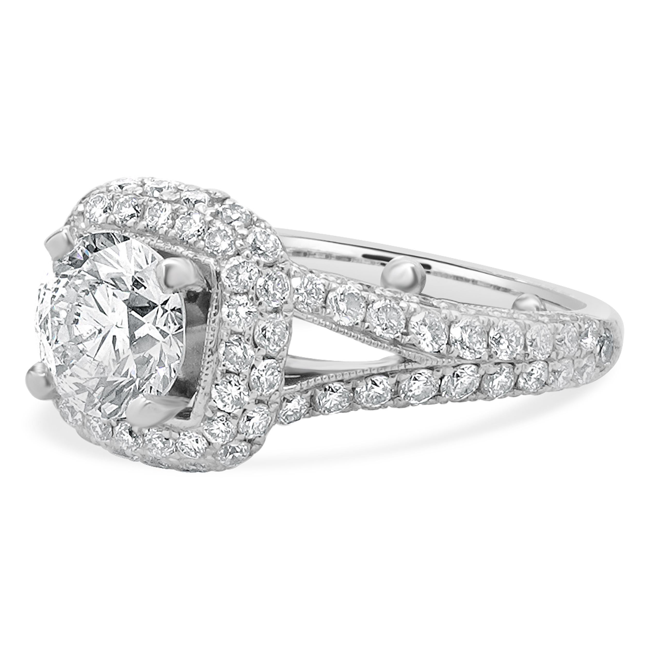 Designer: custom
Material: 14K white gold
Diamond:  1 round brilliant cut = 1.39ct
Color: L
Clarity: SI2
Diamond:  round brilliant cut = 1.50cttw
Color: G
Clarity: SI1
Ring Size: 6 (complimentary sizing available)
Weight: 6.64 grams
